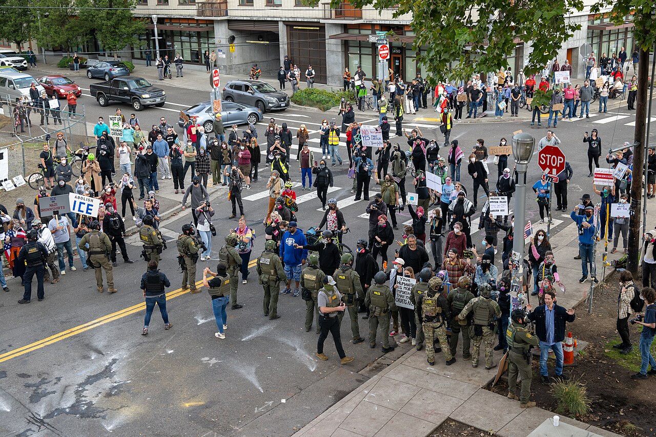 Protesters amass on the street as federal officers from the U.S. Bureau of Prisons, U.S. Customs and Border Protection, U.S. Border Patrol, Homeland Security Investigations and U.S.