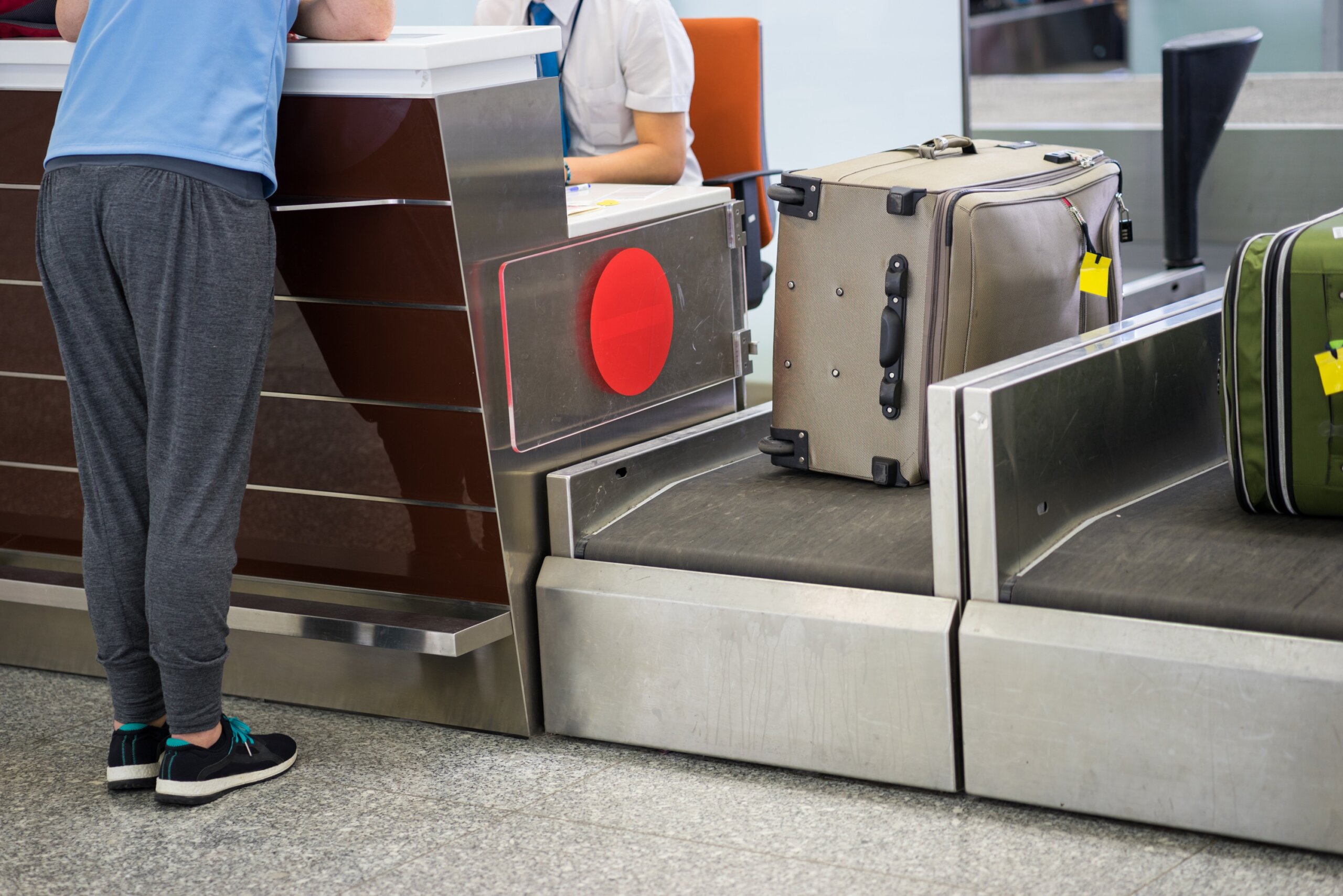 Luggage weighting at check-in desk at Asia airport
