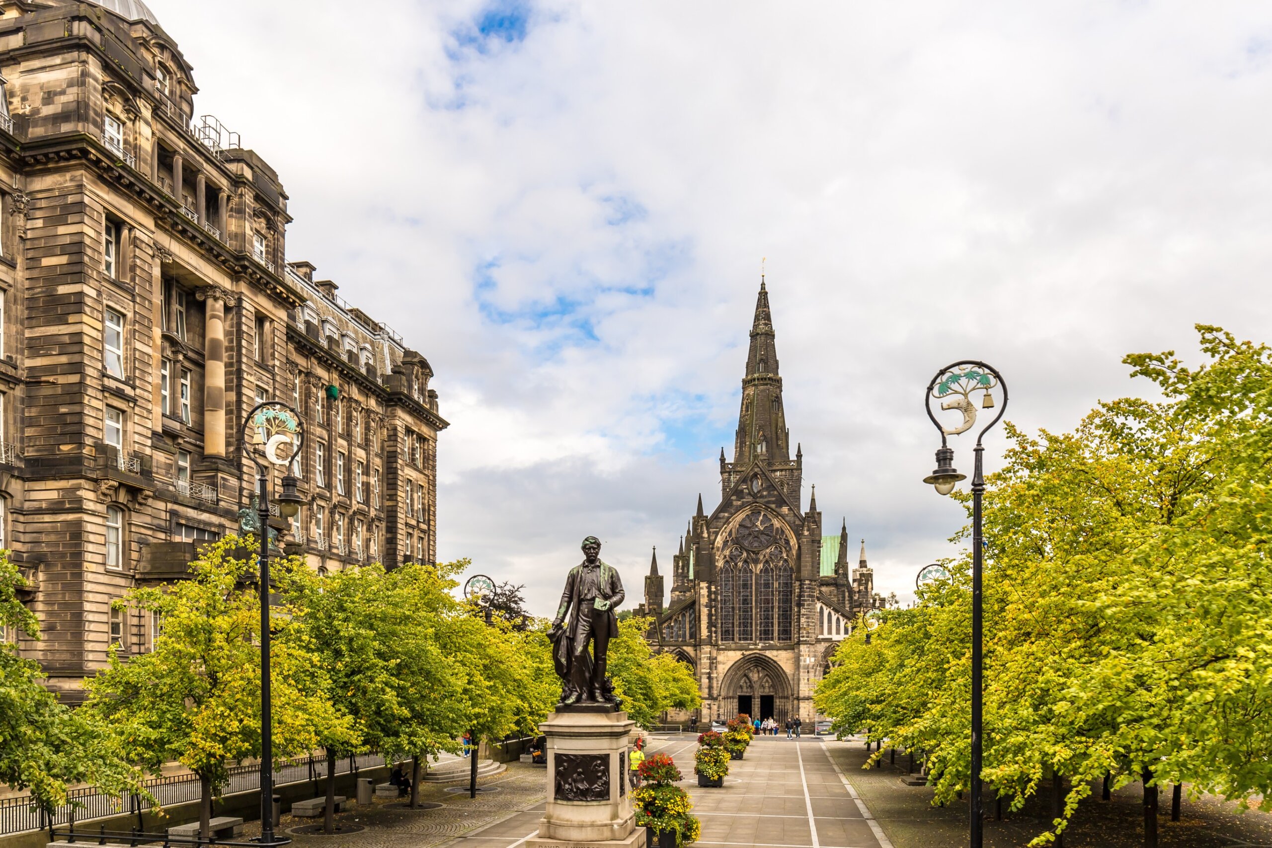 Glasgow Cathedral with historic buildings and trees in central Glasgow, Scotland