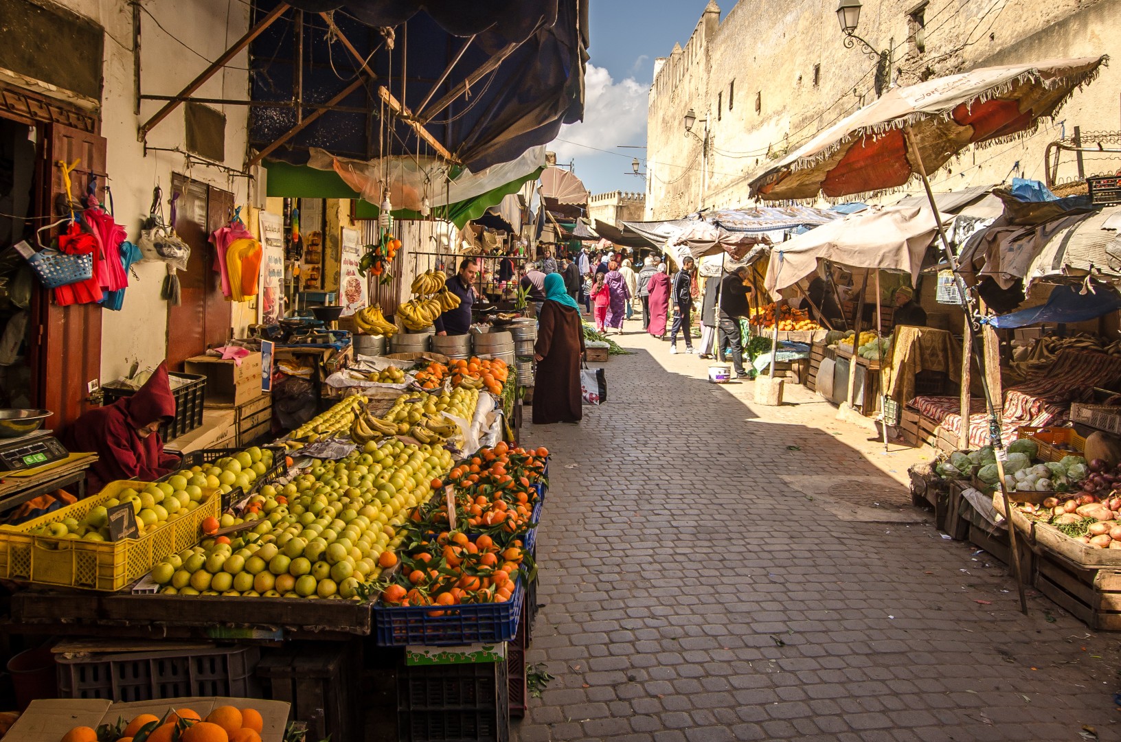 FEZ, MOROCCO - Februari 25, 2018: Fruit marking in the old Medina of Fez city dutring a sunny day
