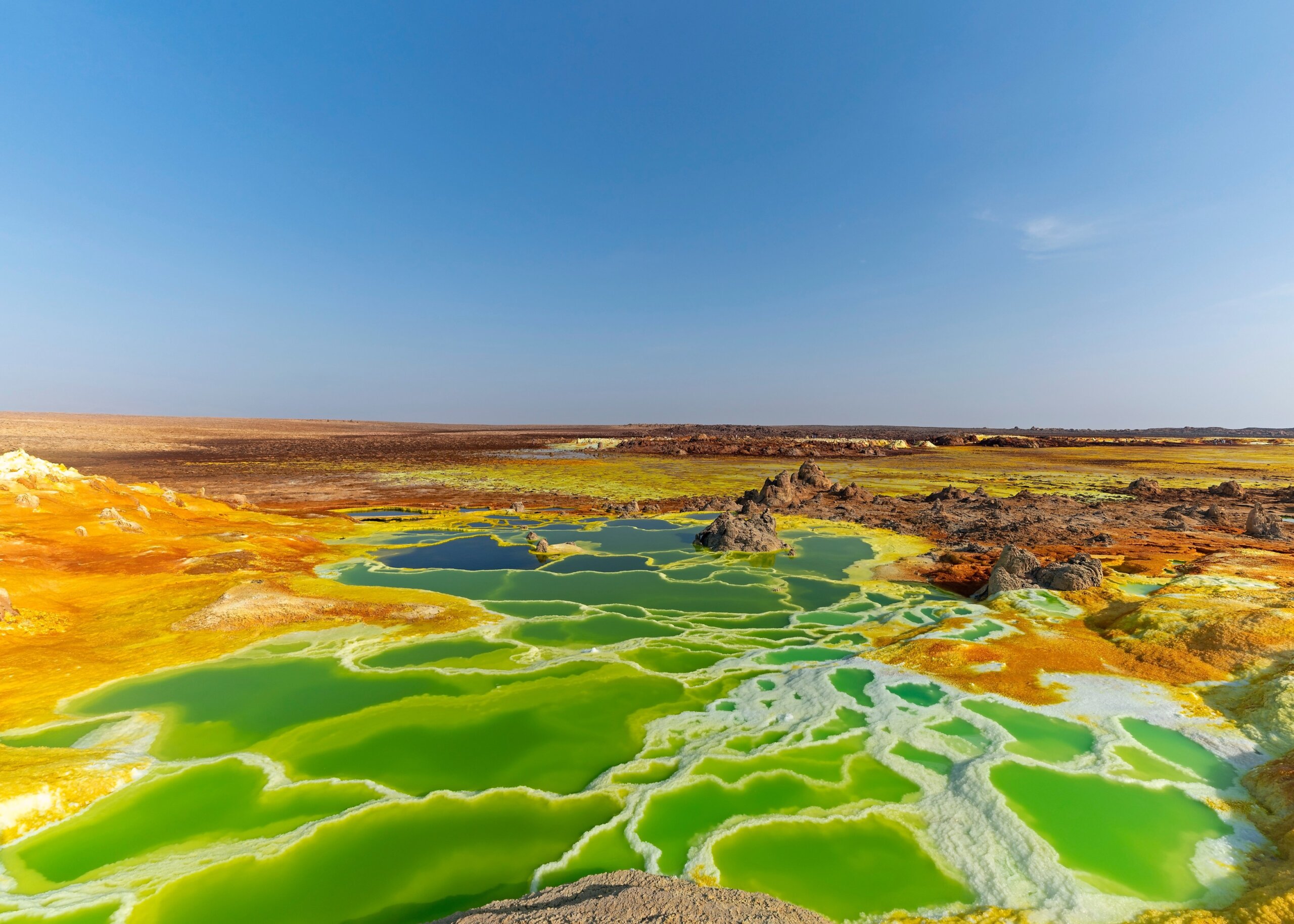Hot springs bring mineral up to the surface and create fantastic colorful ponds and terraces at Dallol volcano in Danakil Depression of Ethiopia.