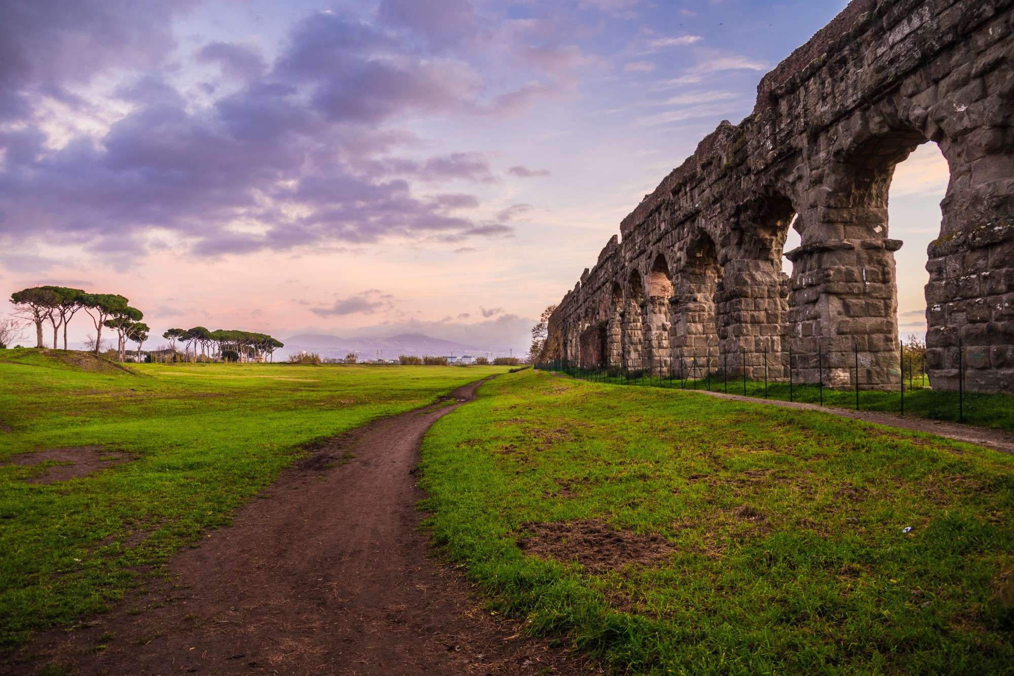 Best preserved Roman aqueduct arches in the countryside at sunset