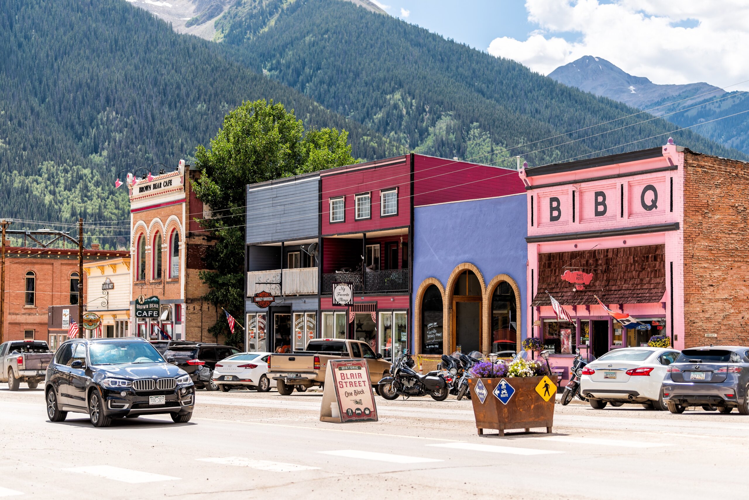 Small town village in Colorado with main road and colorful vibrant multicolored historic architecture houses and Blair street sign
