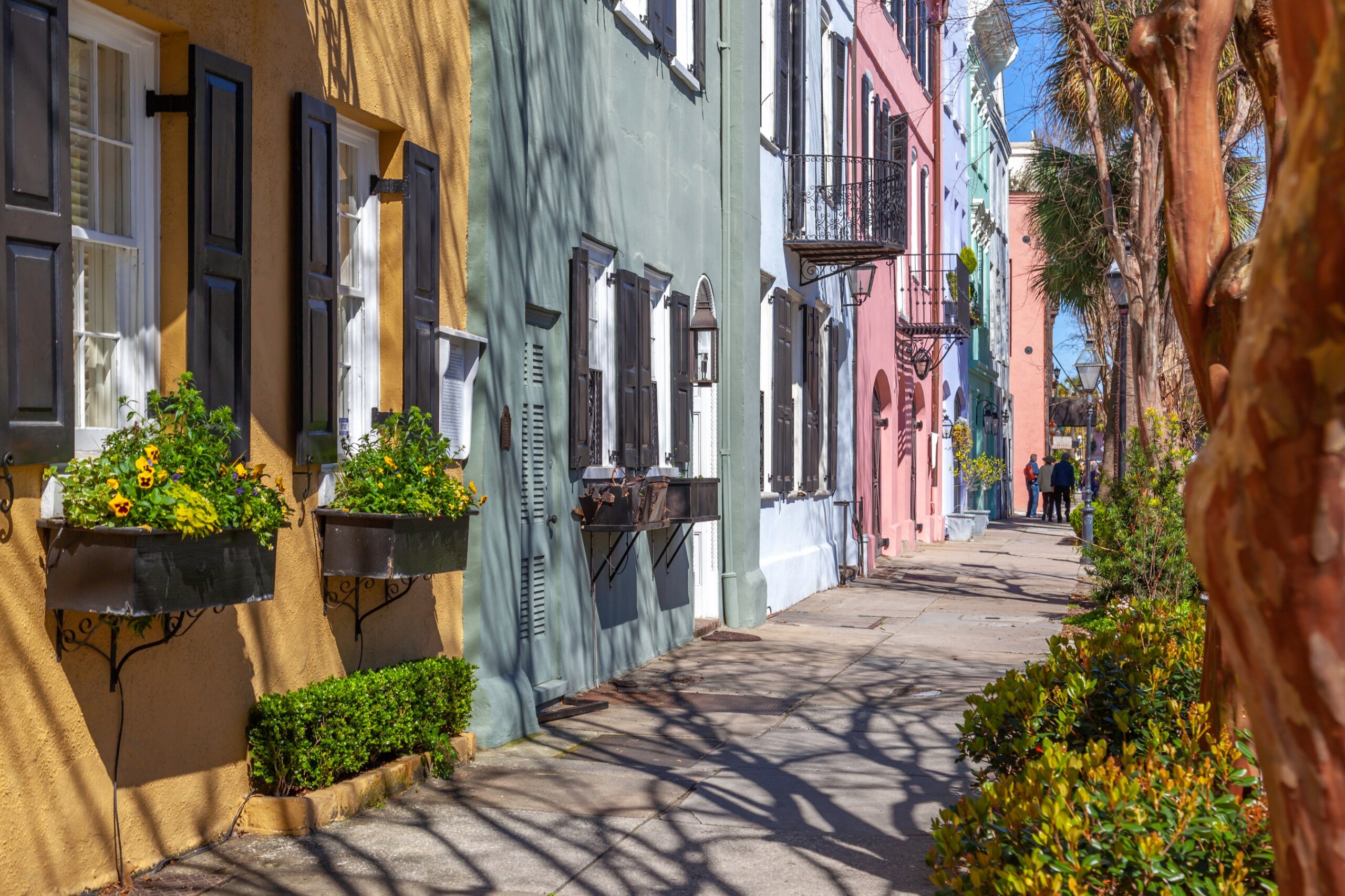 Rainbow Row in the morning, the name for a series of thirteen colorful historic houses in Charleston, South Carolina.
