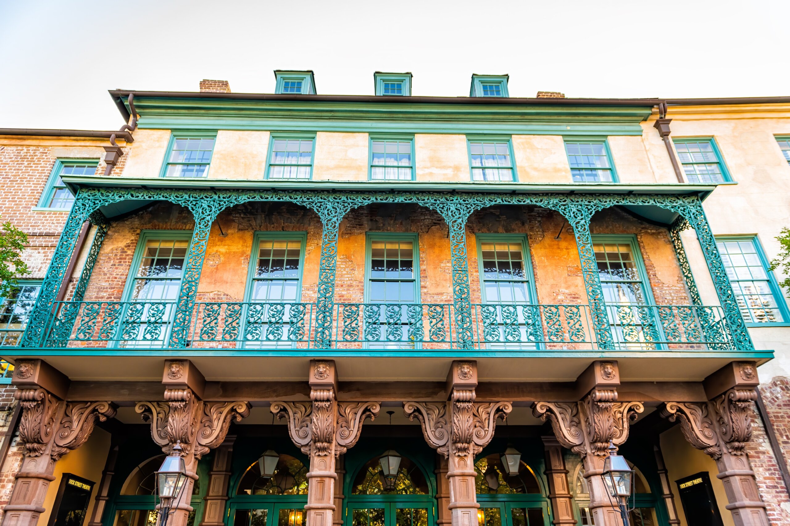 Charleston, USA - May 12, 2018: Dock street theater building facade with rows of stucco columns federal architecture in Charleston, South Carolina French quarter old town