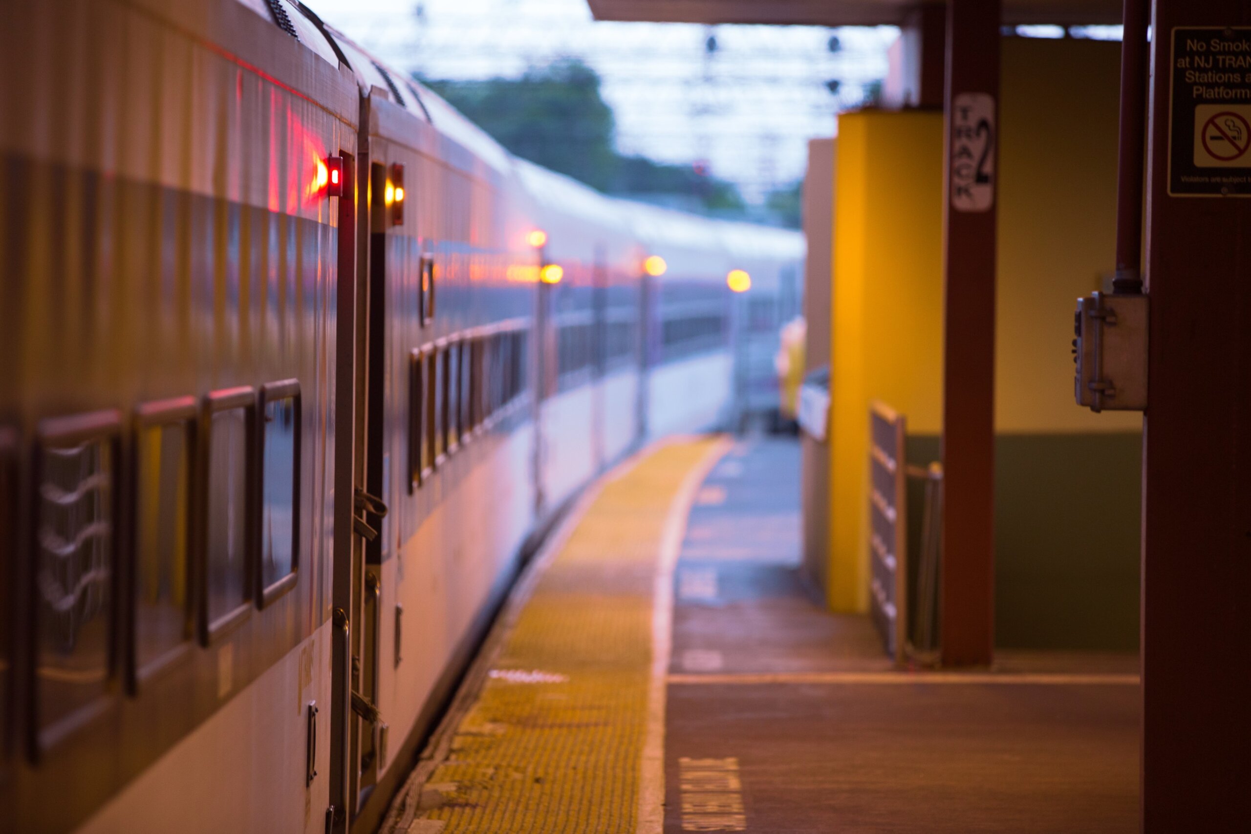 Train pulling into a station at golden hour in Long Branch, New Jersey, USA.
