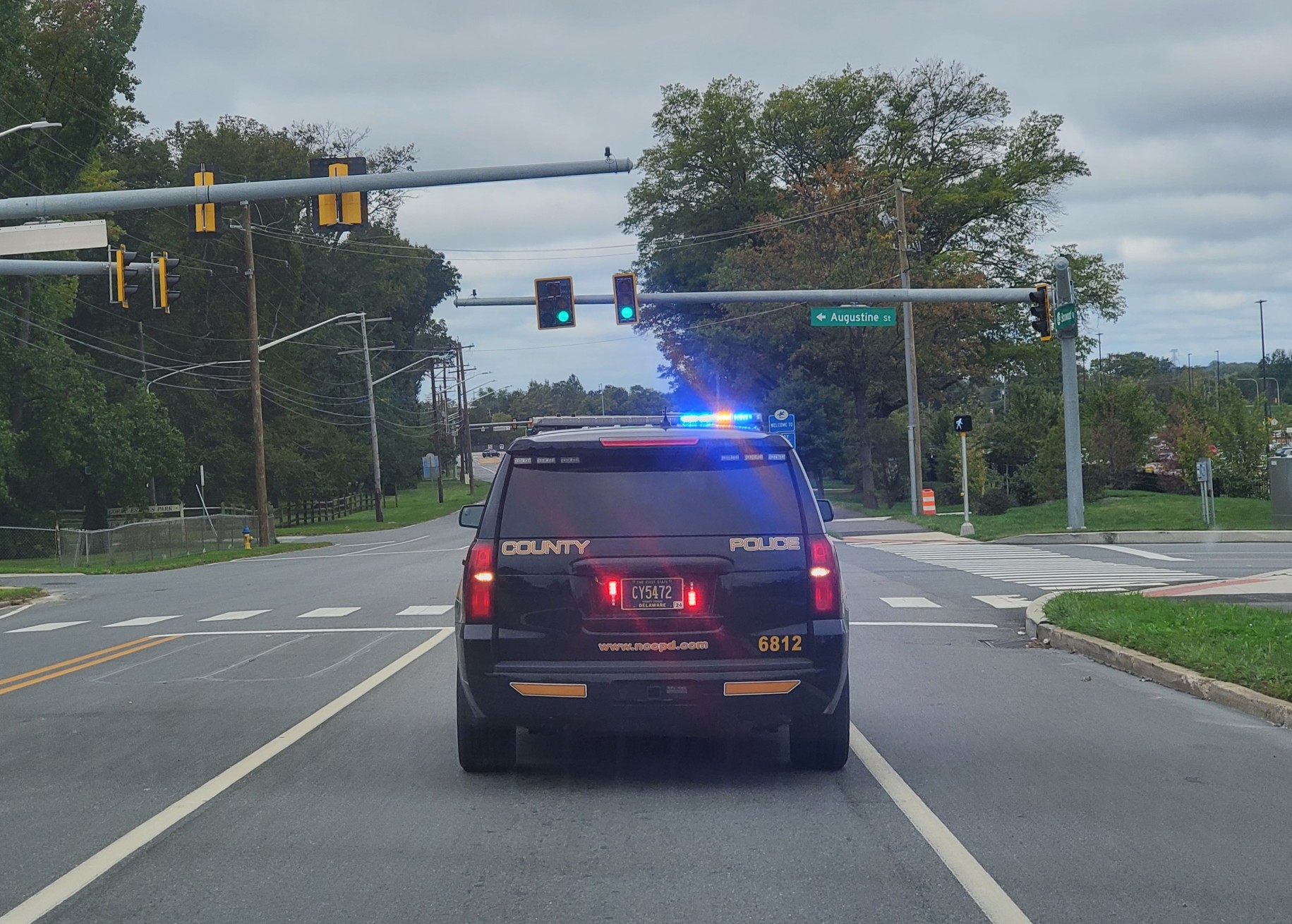 Wilmington, Delaware, U.S.A - September 30, 2023 - A state trooper SUV roaming the street with the siren on
