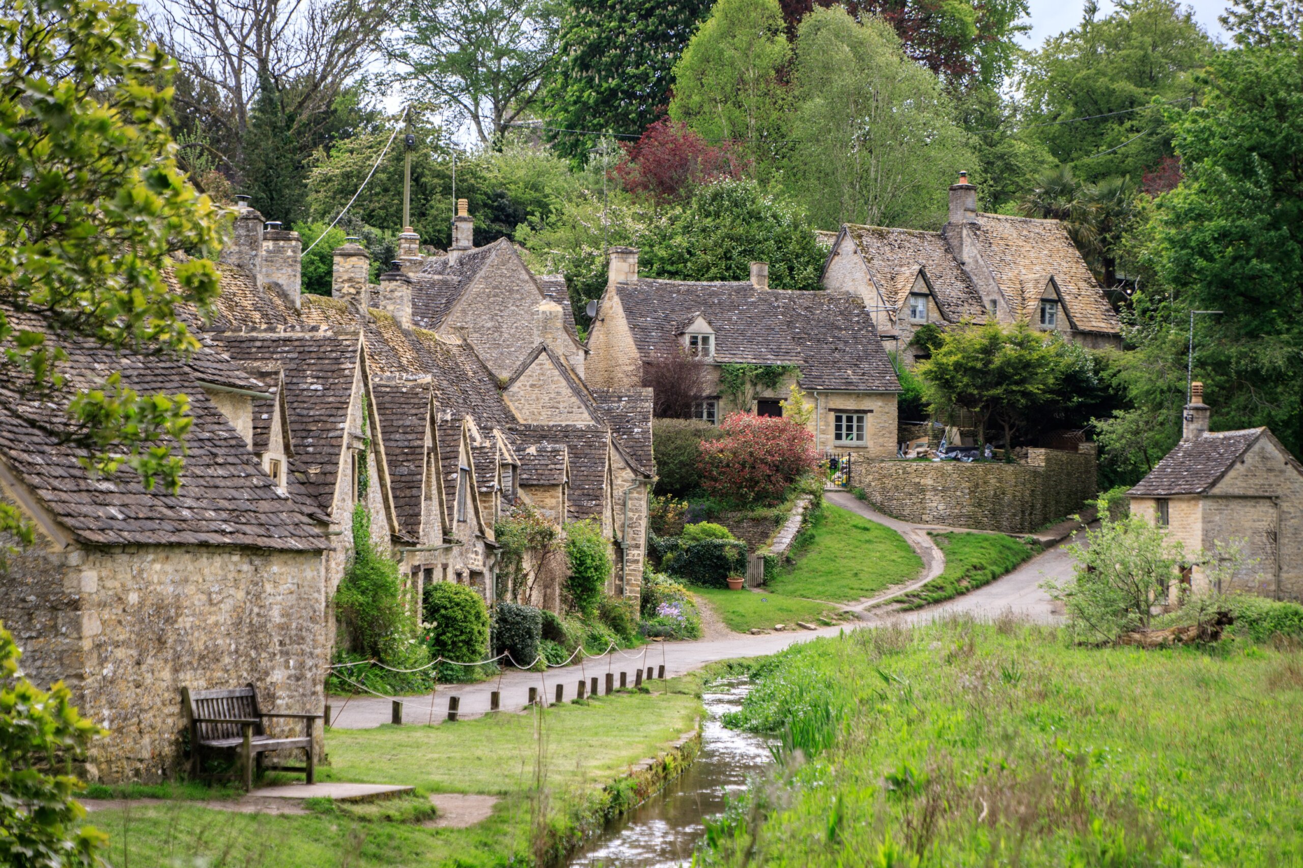 Stone cottages in a small town village surrounded by greenery
