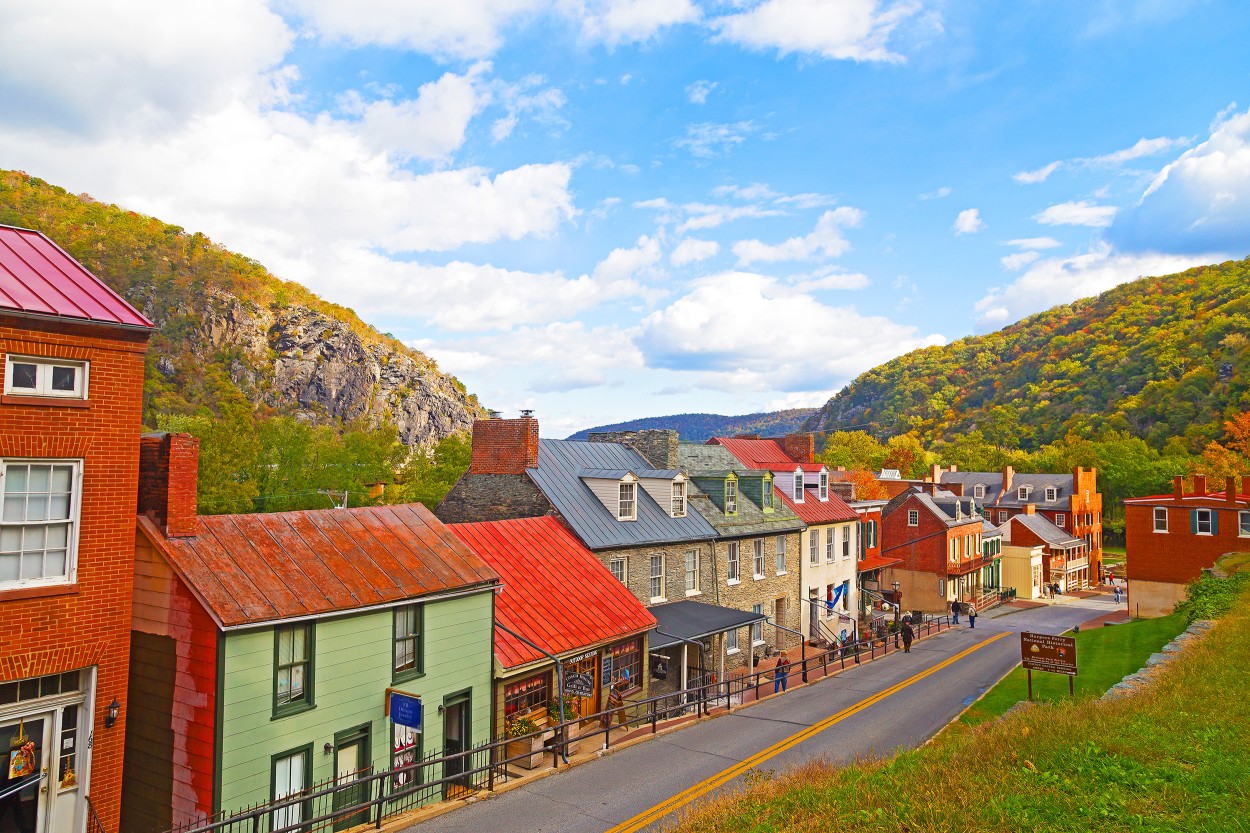 Harpers Ferry historic town in autumn and Blue Ridge Mountains. Houses on the street of historic town in Harpers Ferry National Historical Park, West Virginia, USA.