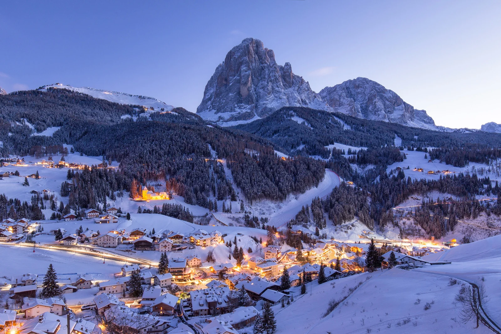 Snowy village in the Dolomites at dusk, representing Milano Cortina 2026 and the 2026 Winter Olympics