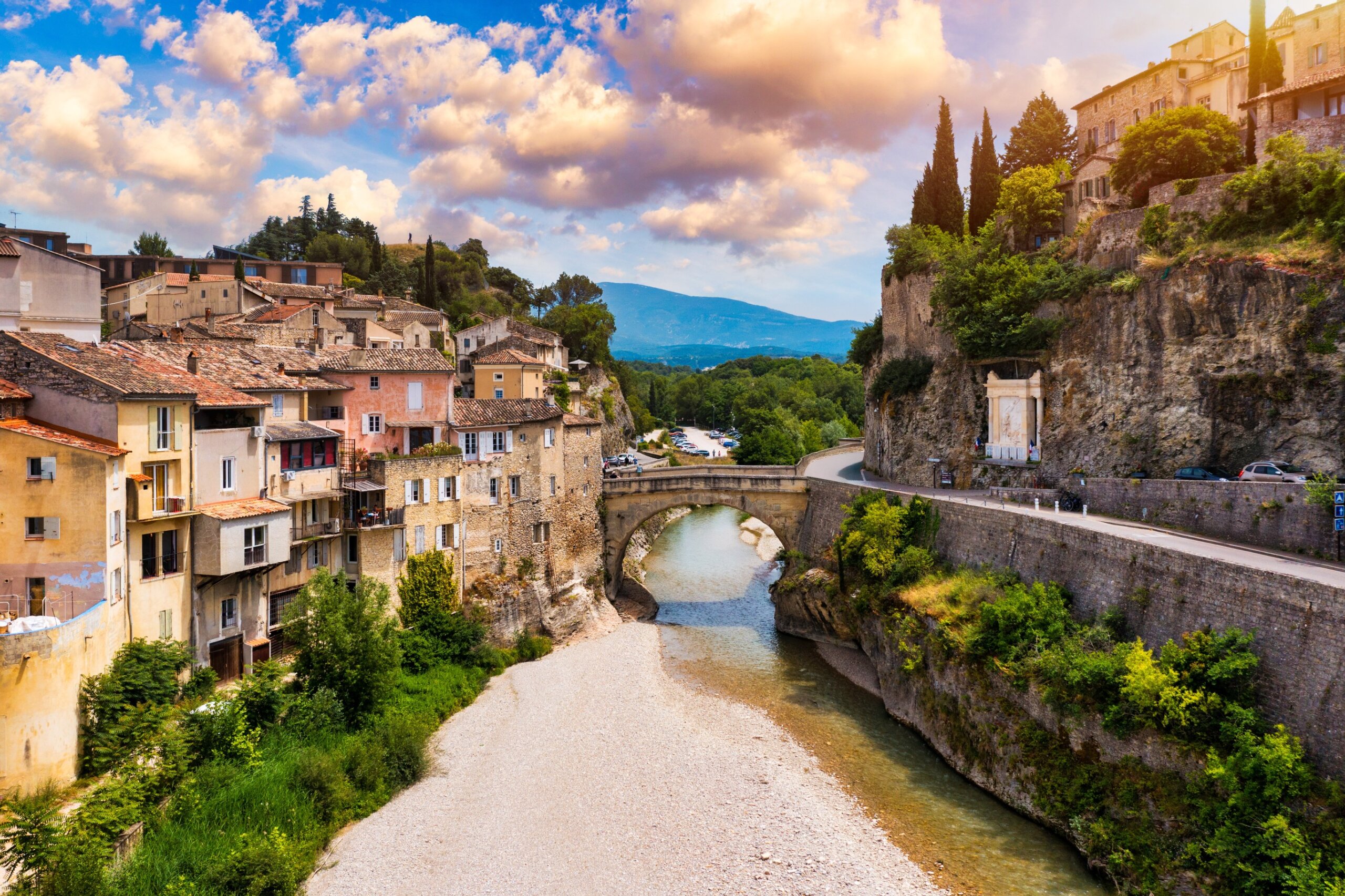 Historic hilltop village and river in France representing a profound cultural experience