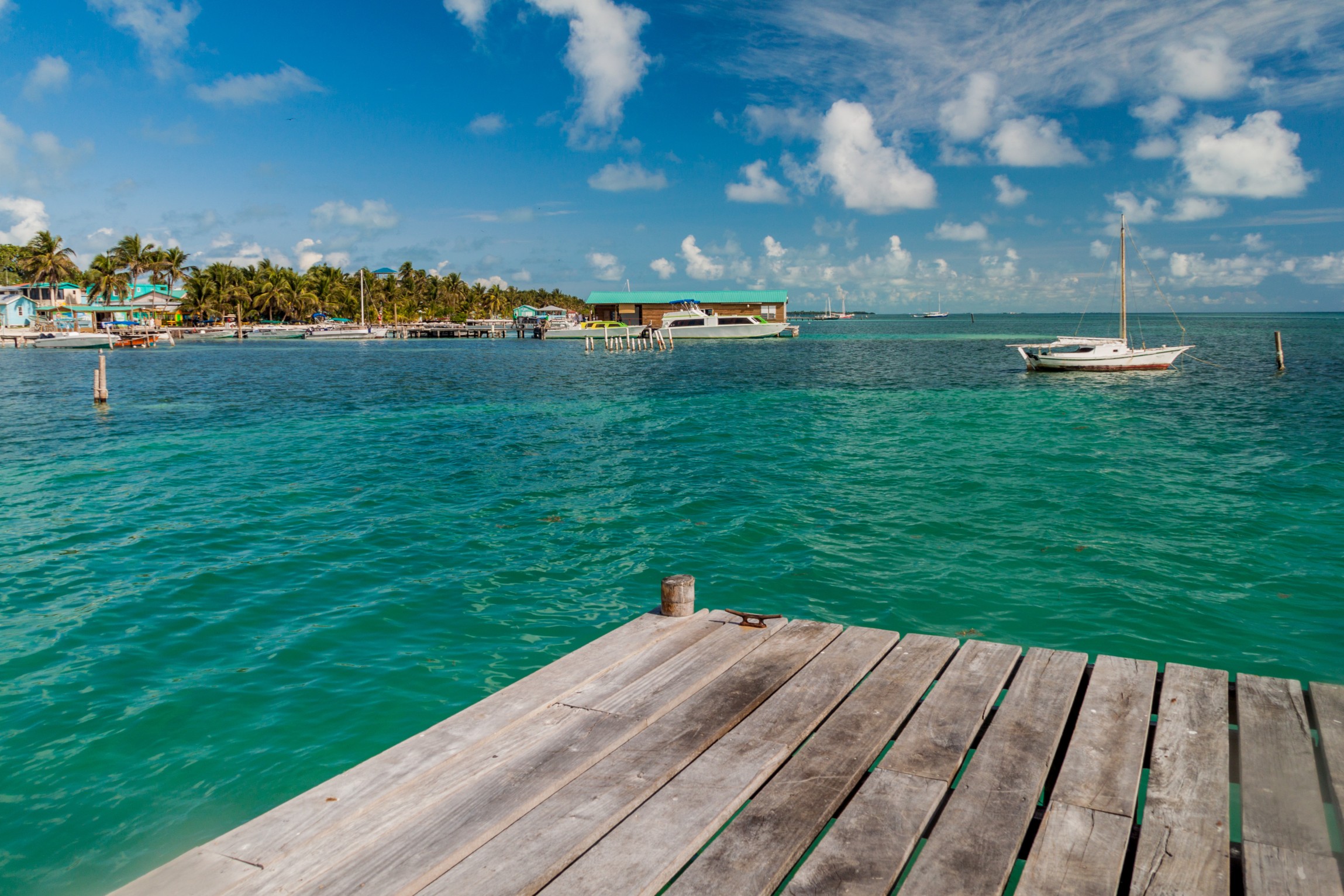 View of Caye Caulker village from a wooden pier, Belize