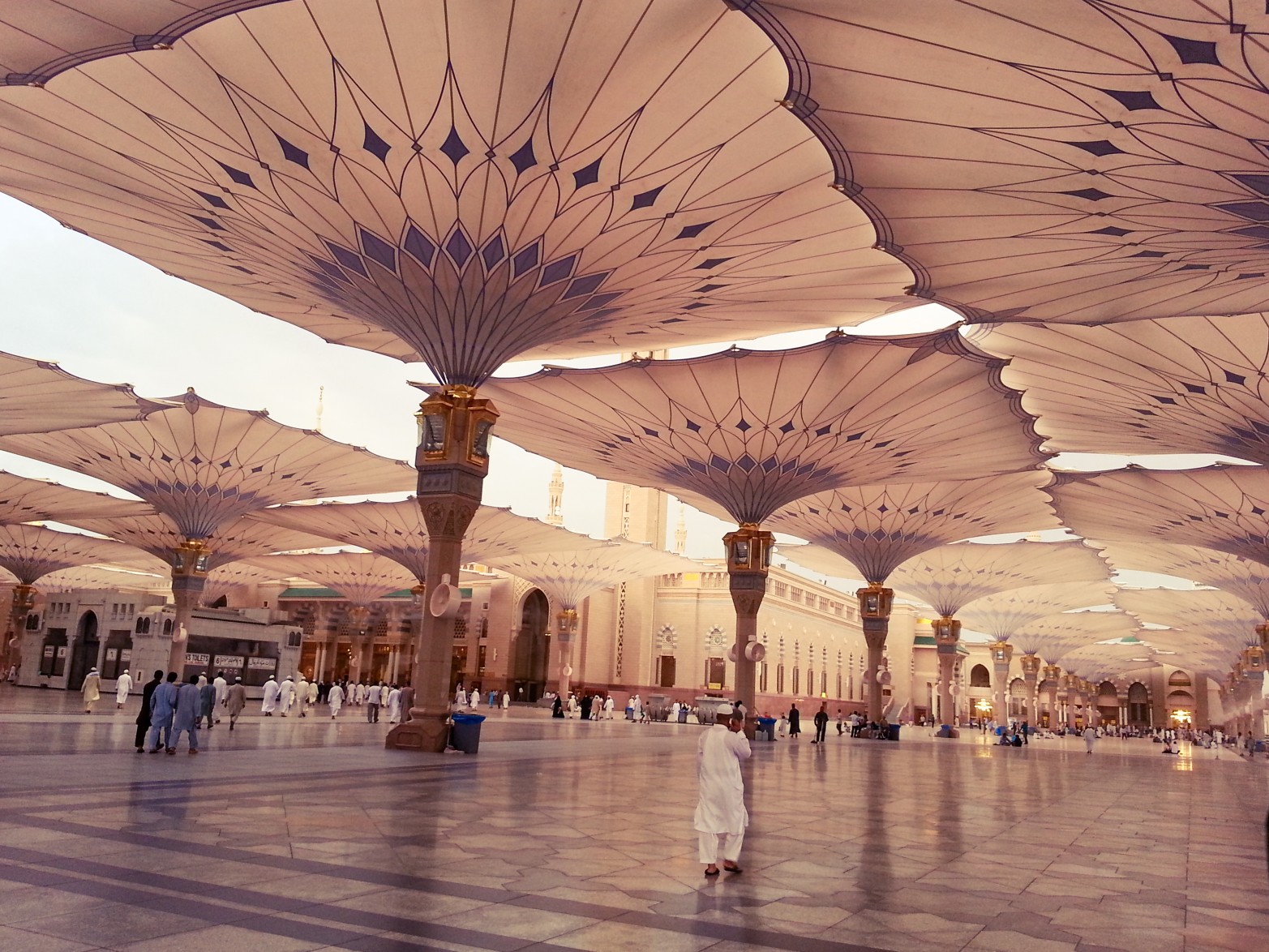 Medina / Saudi Arabia - 16 Sep 2013 : Muslim pilgrims entering to Masjid al-Nabawi ( Prophet's Mosque ) for the Maghrib prayer.
