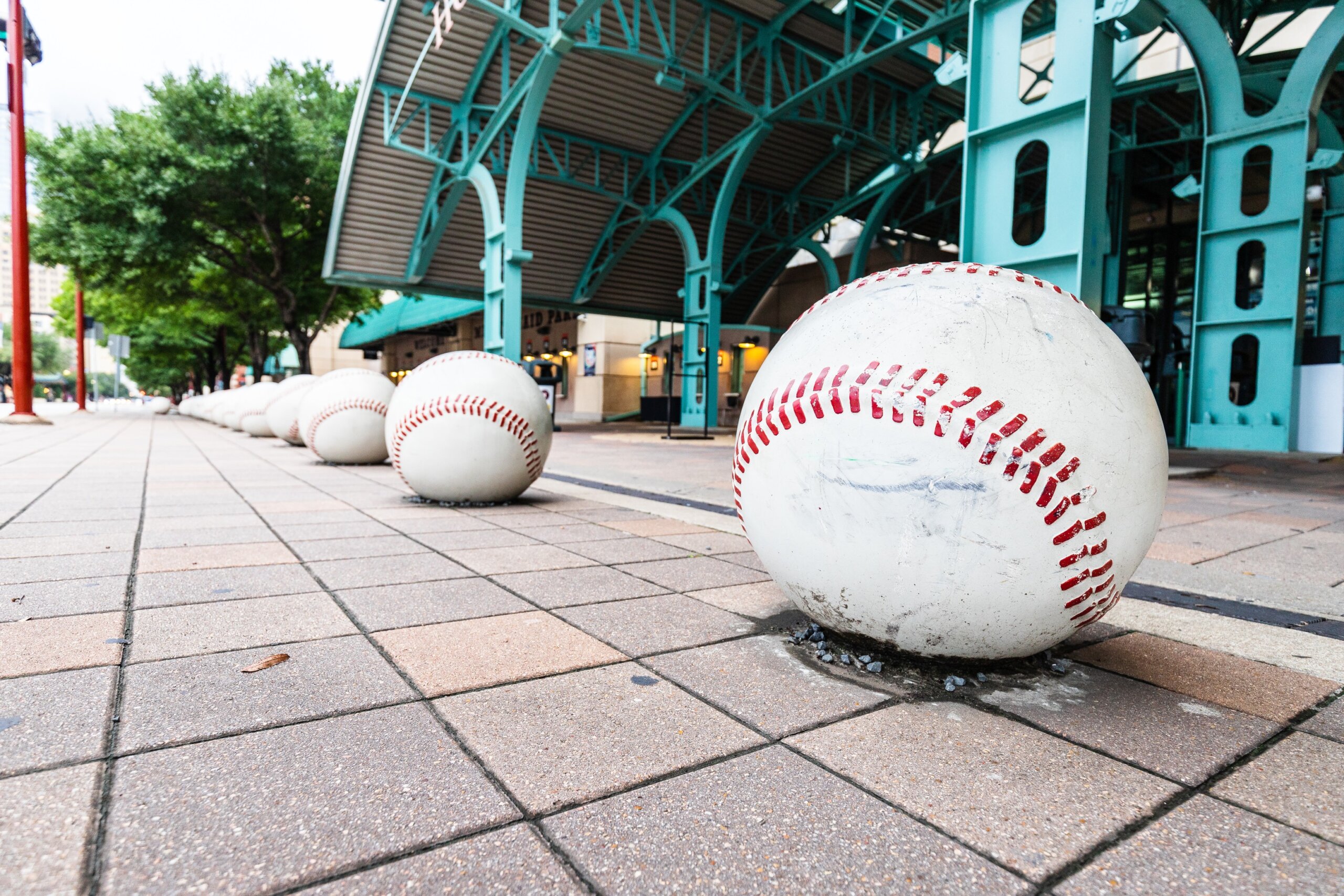 Oversized baseball's sit outside of Minute Maid Stadium, home to the MLB's Houston Astro's. These baseball's sit at most of the entrances to this sports stadium.