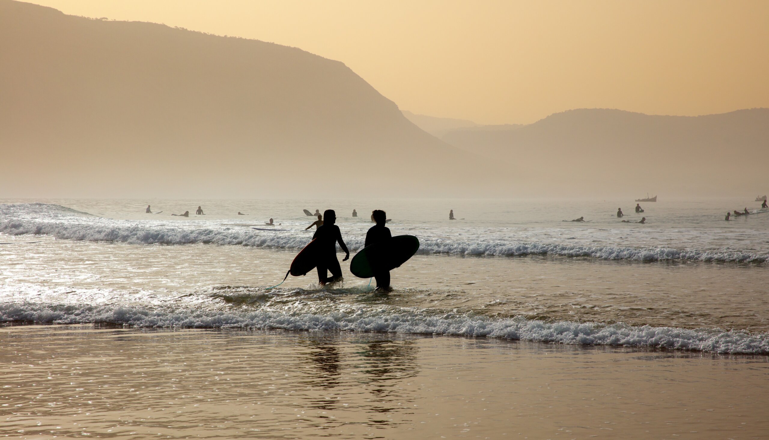 silhouette of surfer in wave- Morocco

