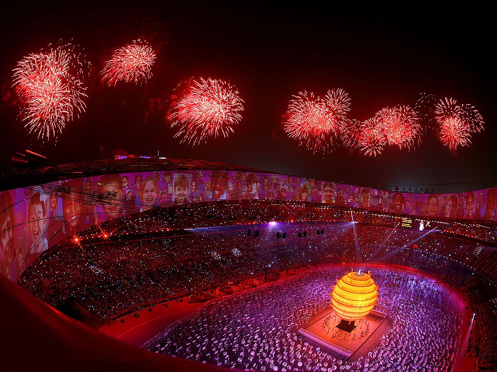 Fireworks over an Olympic stadium during opening ceremony, representing top Olympic cities ranked