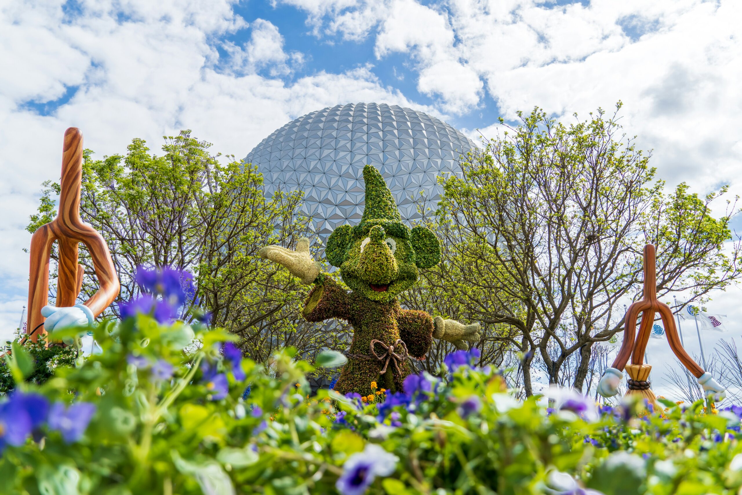 Disney character topiary at EPCOT Flower and Garden Festival 2026 with Spaceship Earth behind it