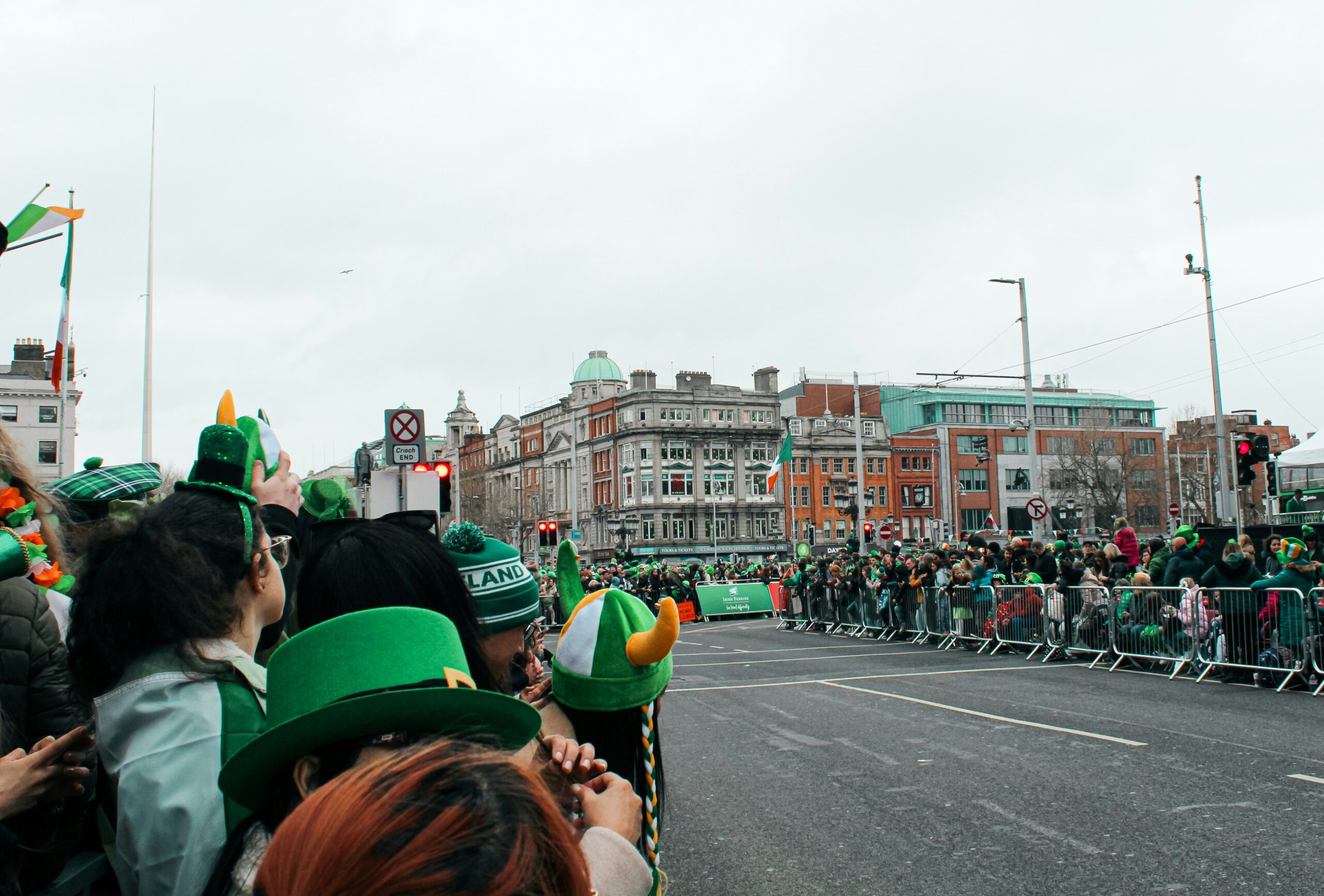 St. Patrick’s Day parade crowd in Dublin with spectators wearing green along city streets