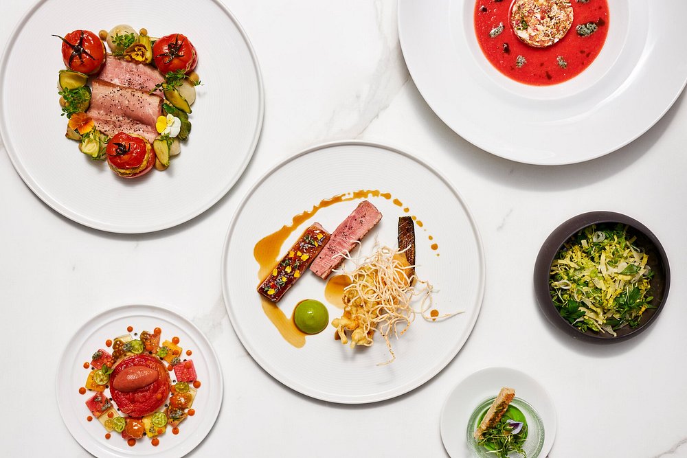 Veal Chop, Eggplant and petits Farcis – Tomato all around - Muscovy Duck, Confit leg, Melon and Squash Variation at Restaurant Guy Savoy
