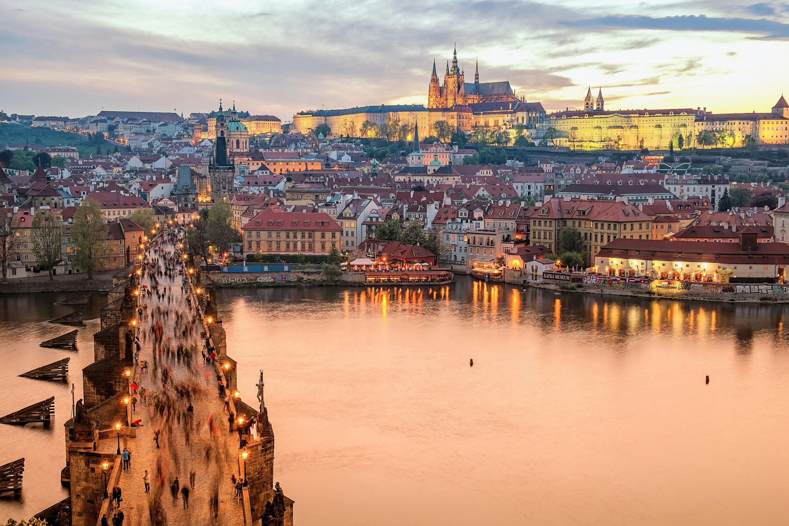 Prague sunset view of the Charles Bridge and Vltava River, romantic European getaway for couples
