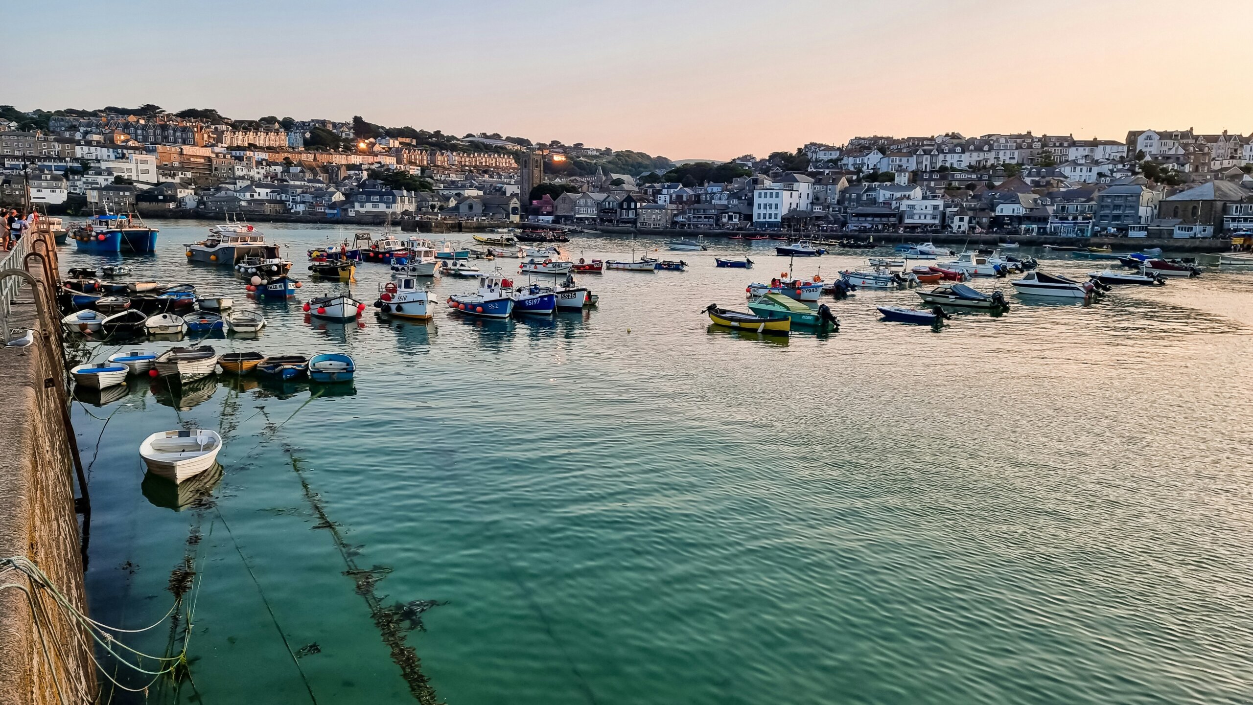 Cornwall harbor with fishing boats during a scenic coastal road trip