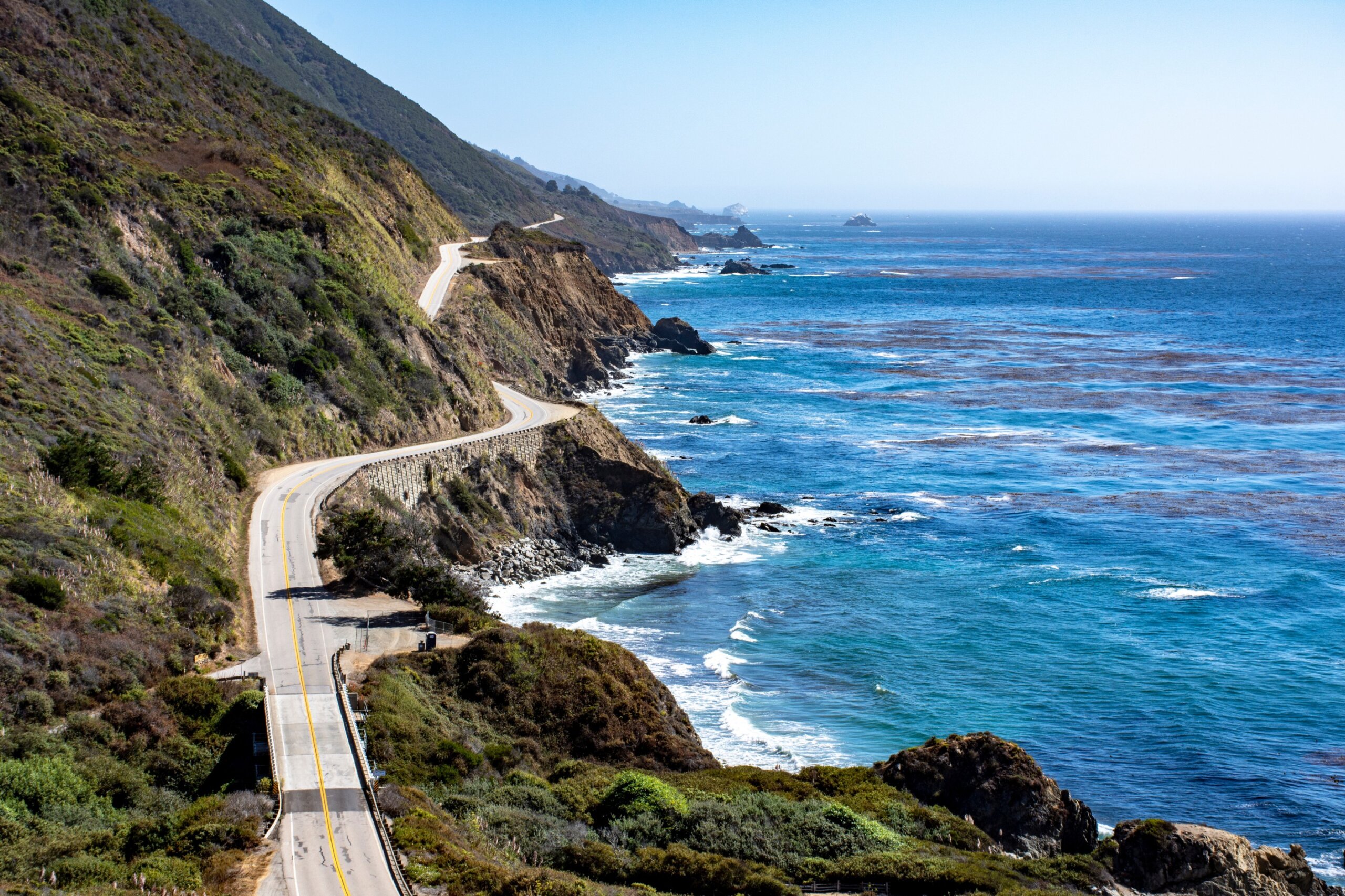 Coastal highway winding along the ocean on a classic American road trip