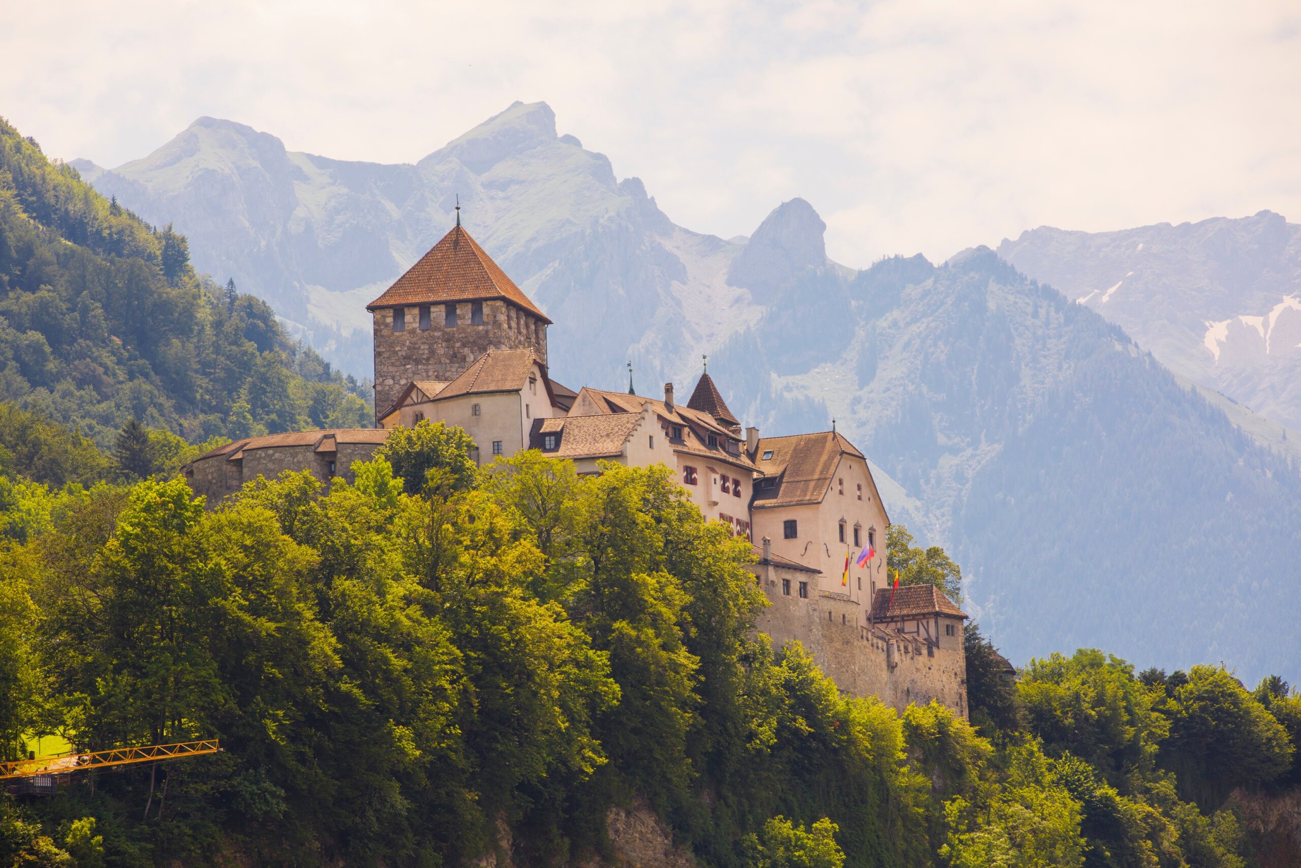 Liechtenstein Castle surrounded by Alps Mountains
