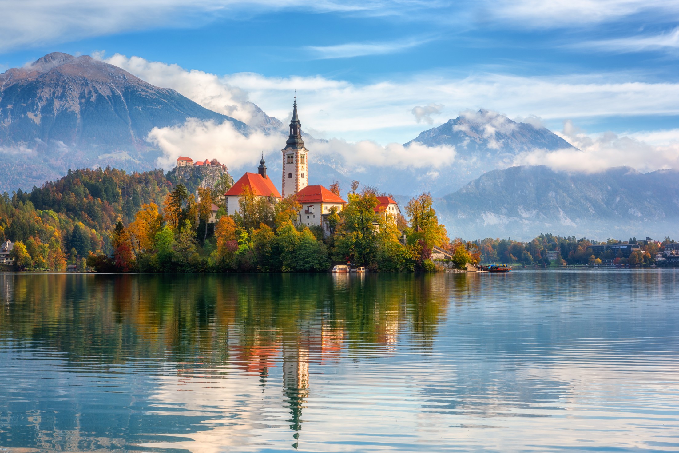 Lake Bled in Slovenia with island church, mountains, and reflections on the water