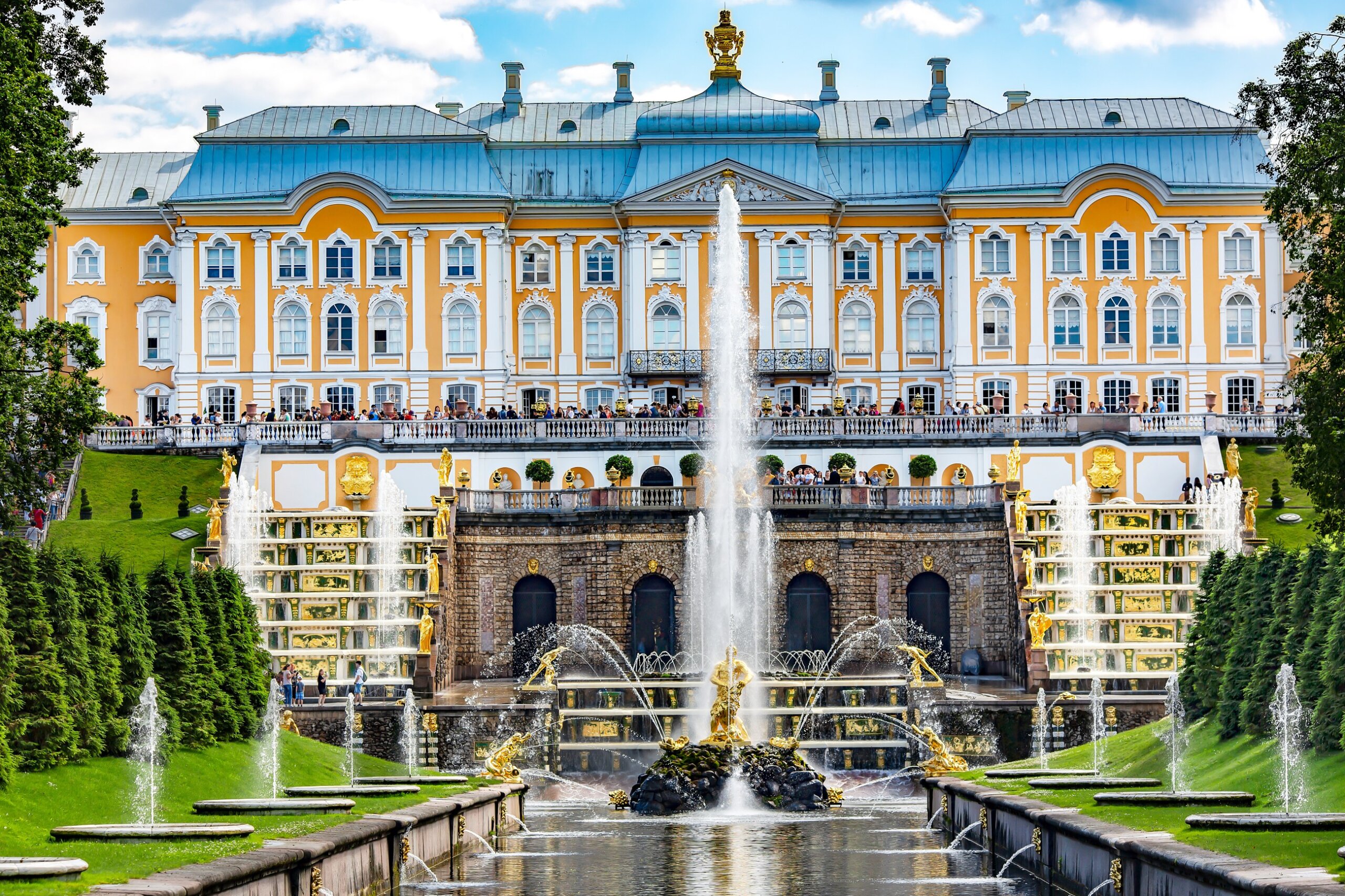 Peterhof Palace fountains in St Petersburg Russia with golden statues and cascading water terraces