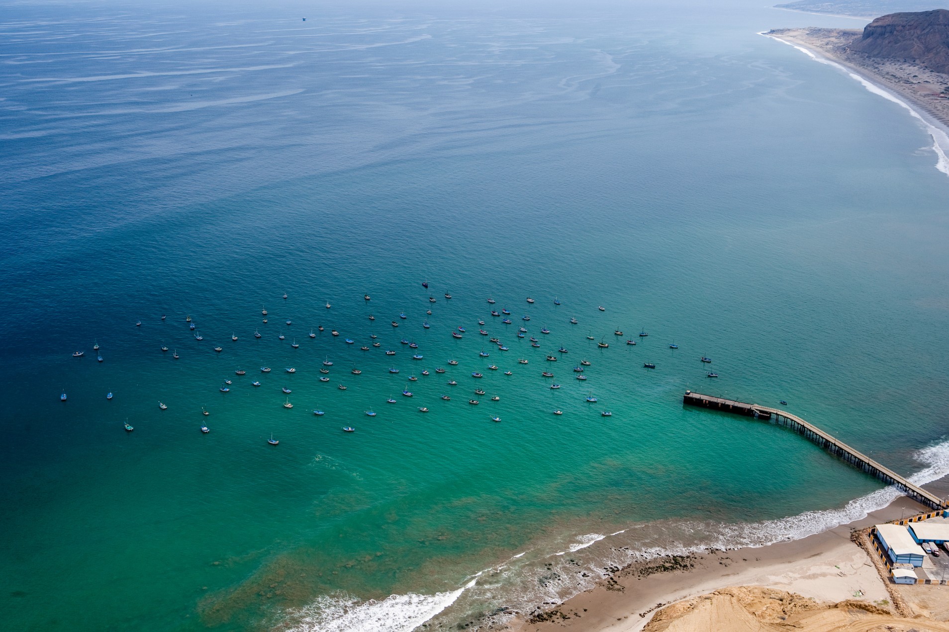 Cabo Blanco Pier and Fishing Boats. Peru
