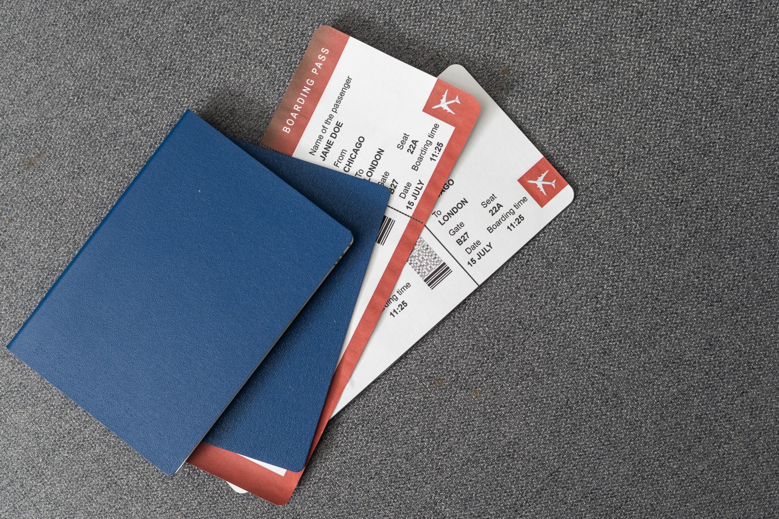Two blue passports, green boarding pass, flight tickets gray background close up top view, airplane travel, passengers check in, customs control, border cross, holidays, vacation, tourism.