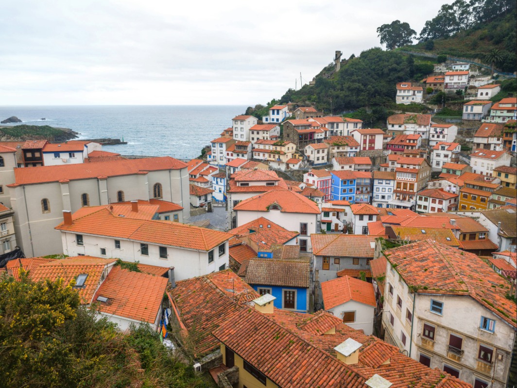 Colorful hillside houses with terracotta rooftops in Cudillero, Asturias, overlooking the Cantabrian Sea in northern Spain