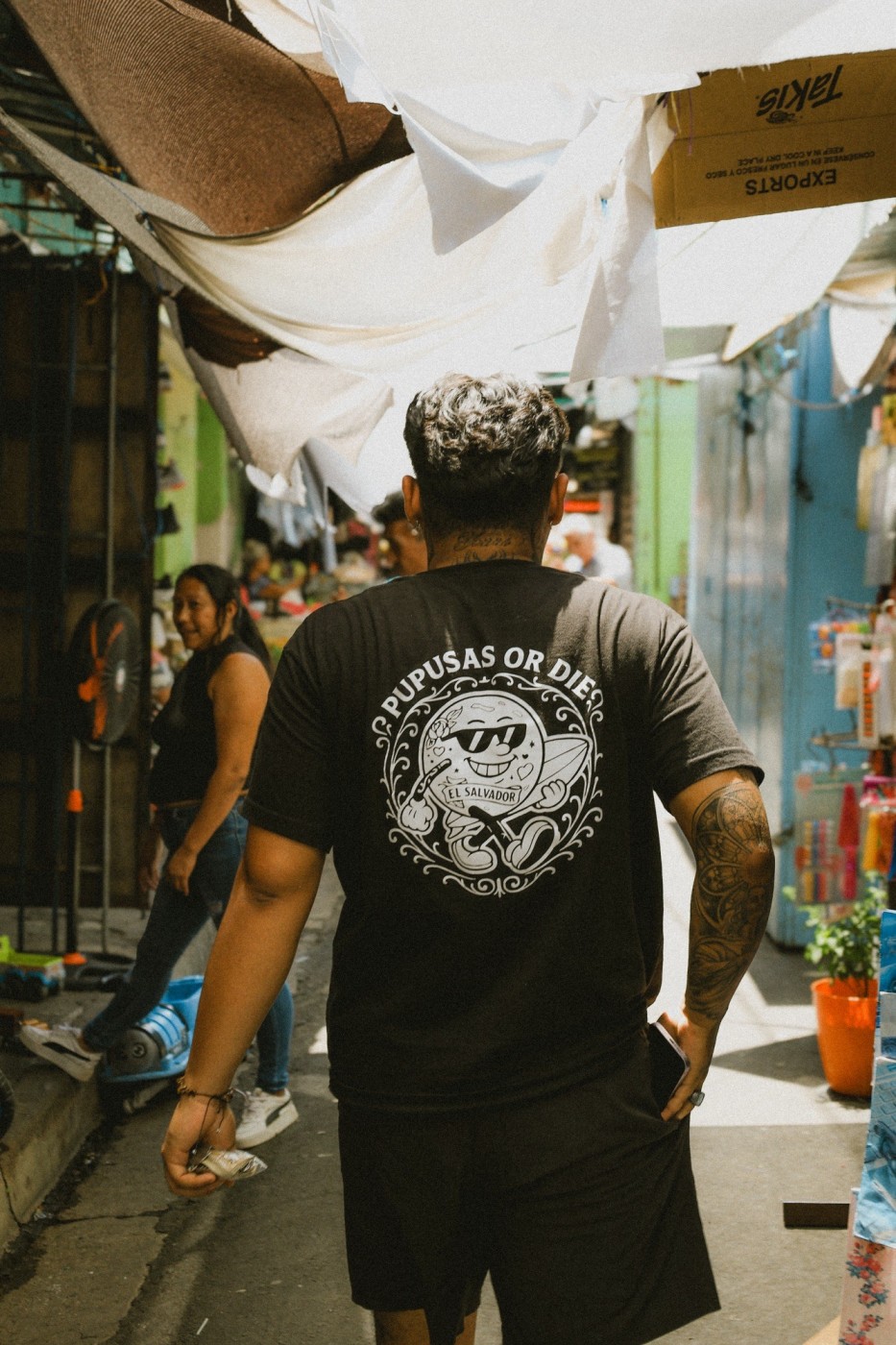 Hector walking us through a local market in Santa Ana, El Salvador. 