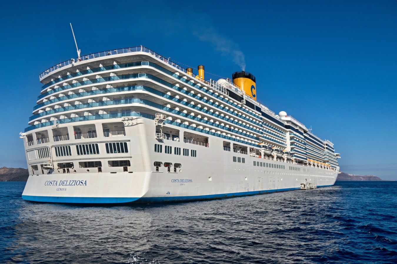 Costa Deliziosa cruise ship sailing on the sea near Santorini, Greece
