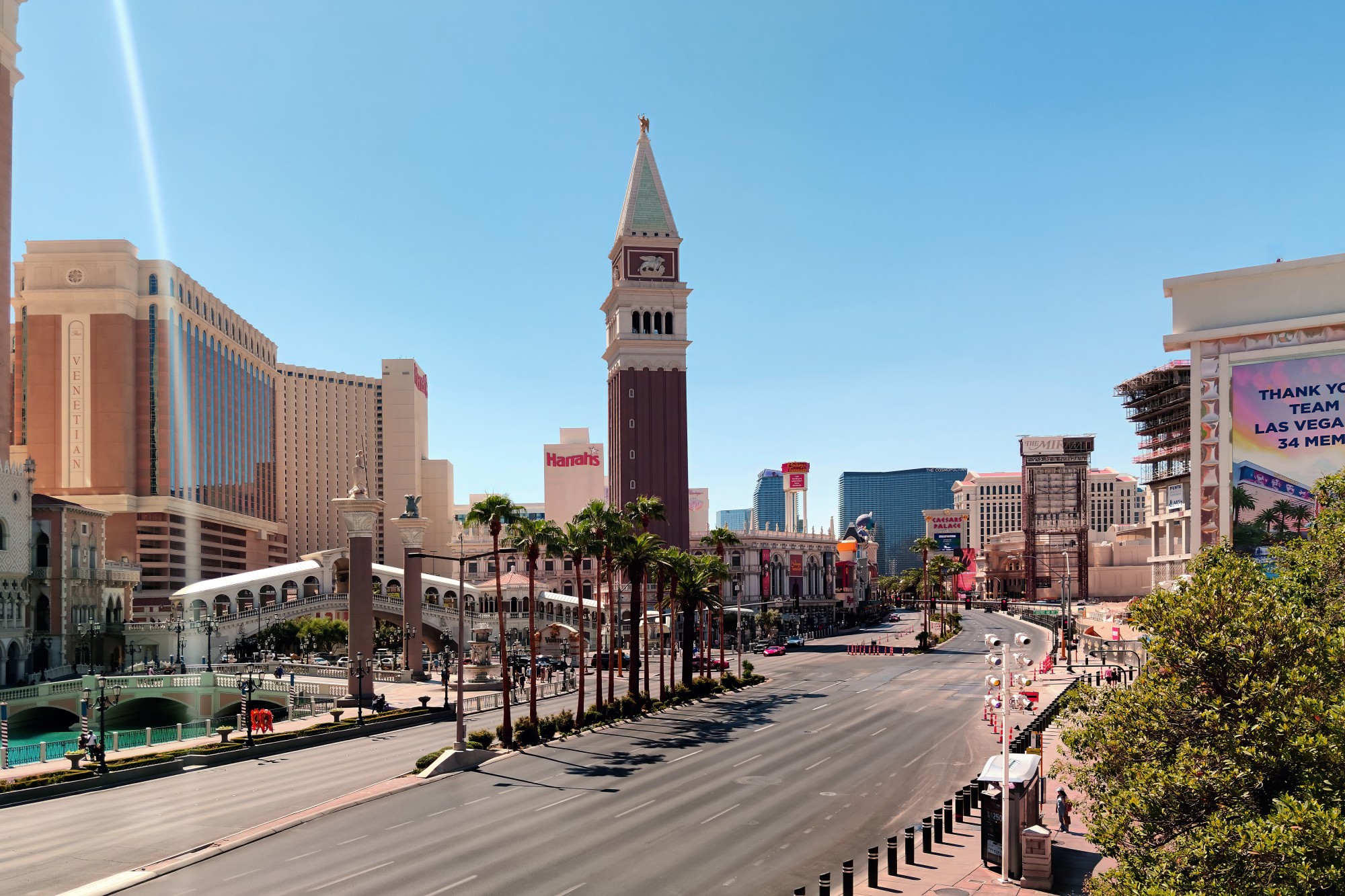 Las Vegas.USA - 09.07.2025: Wide angle view of the Venetian Resort and its famous architectural landmarks along the empty Las Vegas Strip boulevard during a bright summer day
