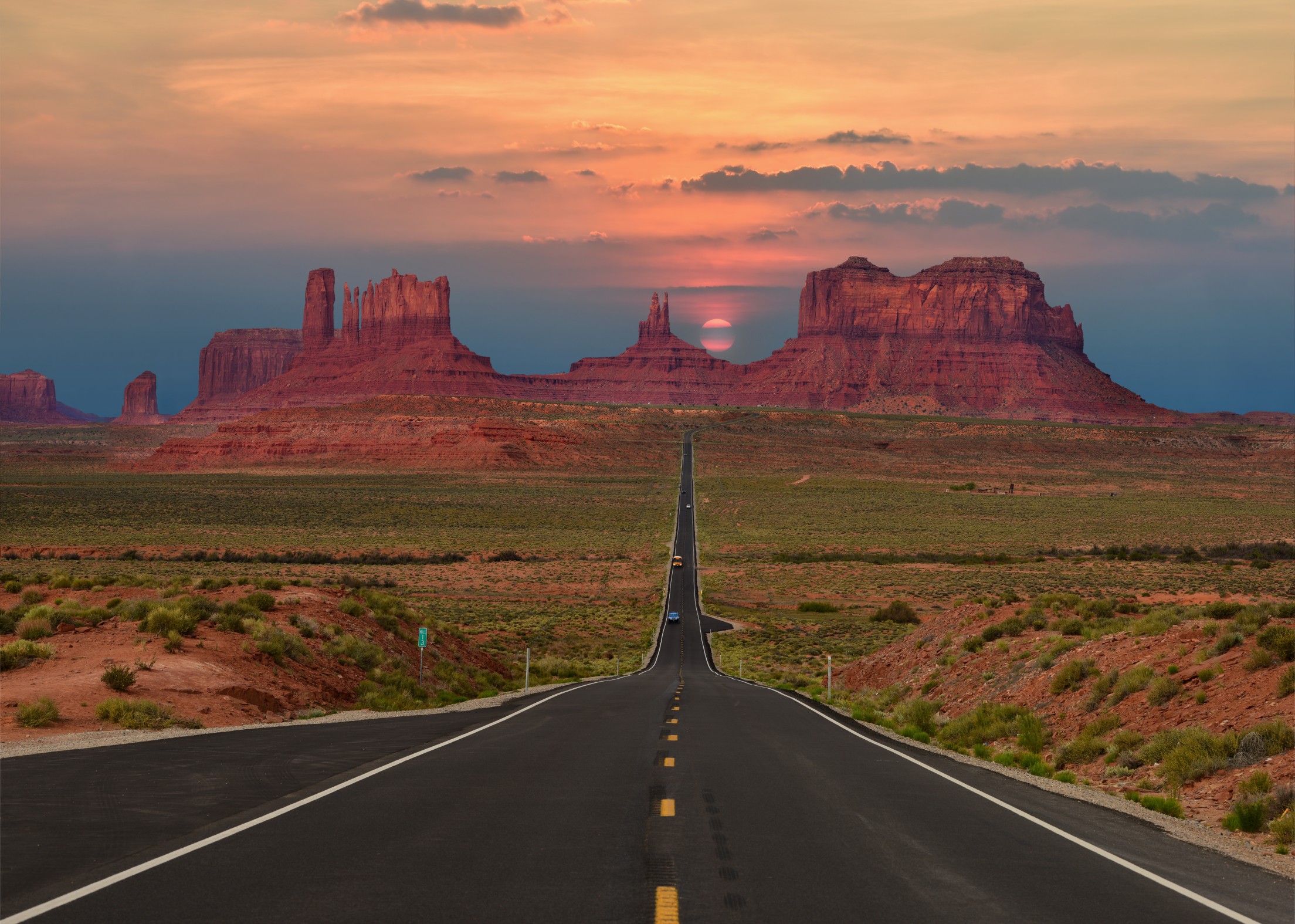 Scenic highway in Monument Valley Tribal Park in Arizona-Utah border, U.S.A. at sunset.