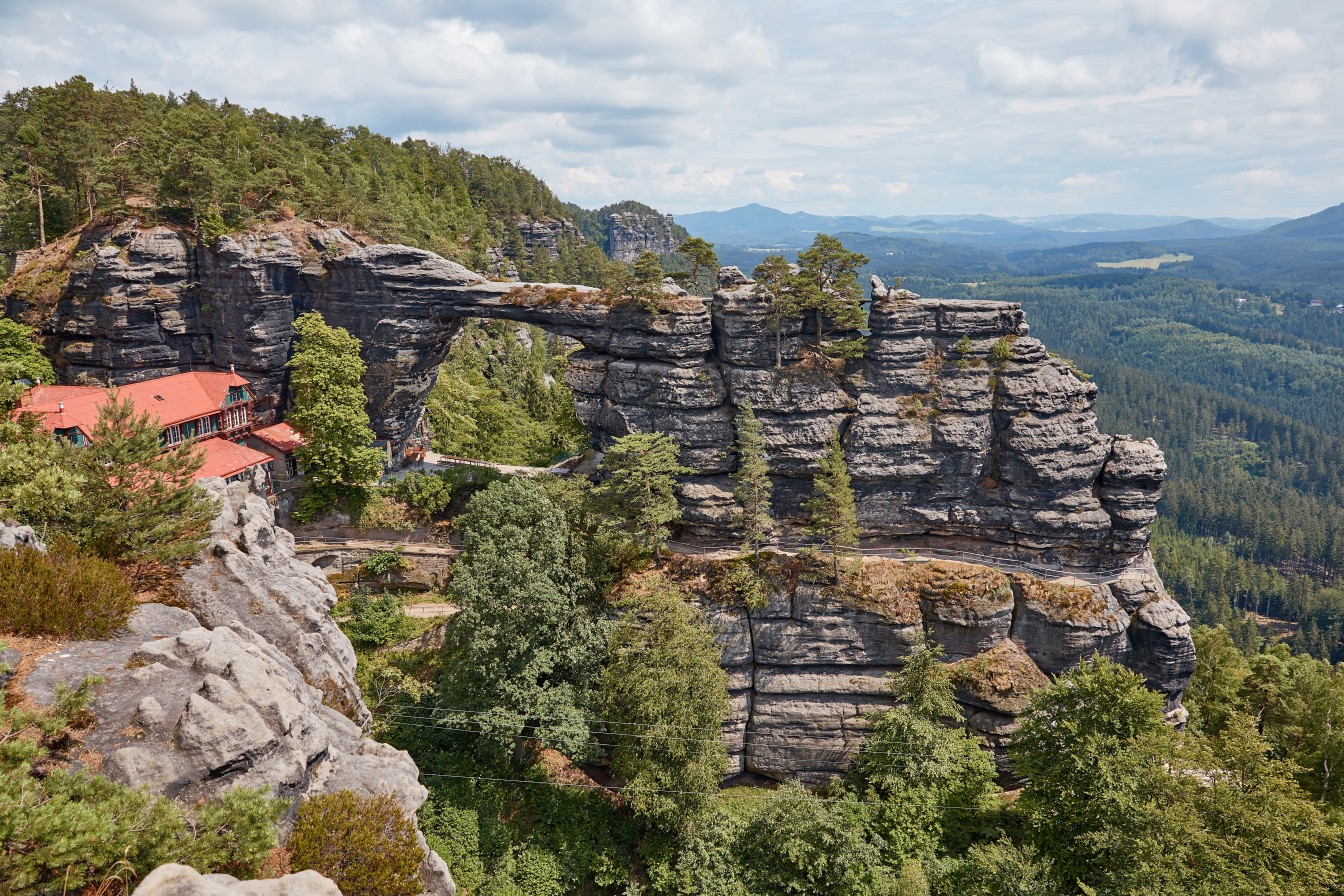 beautiful landscape with pravcicka brana rock formation, Falcons Nest Hotel and forest in Czech Republic
