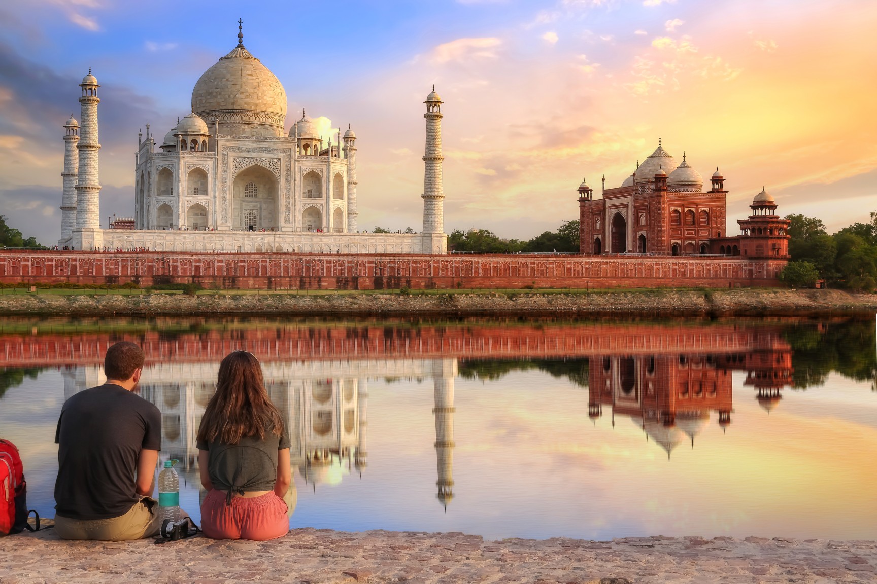American travelers viewing the Taj Mahal at sunrise in India