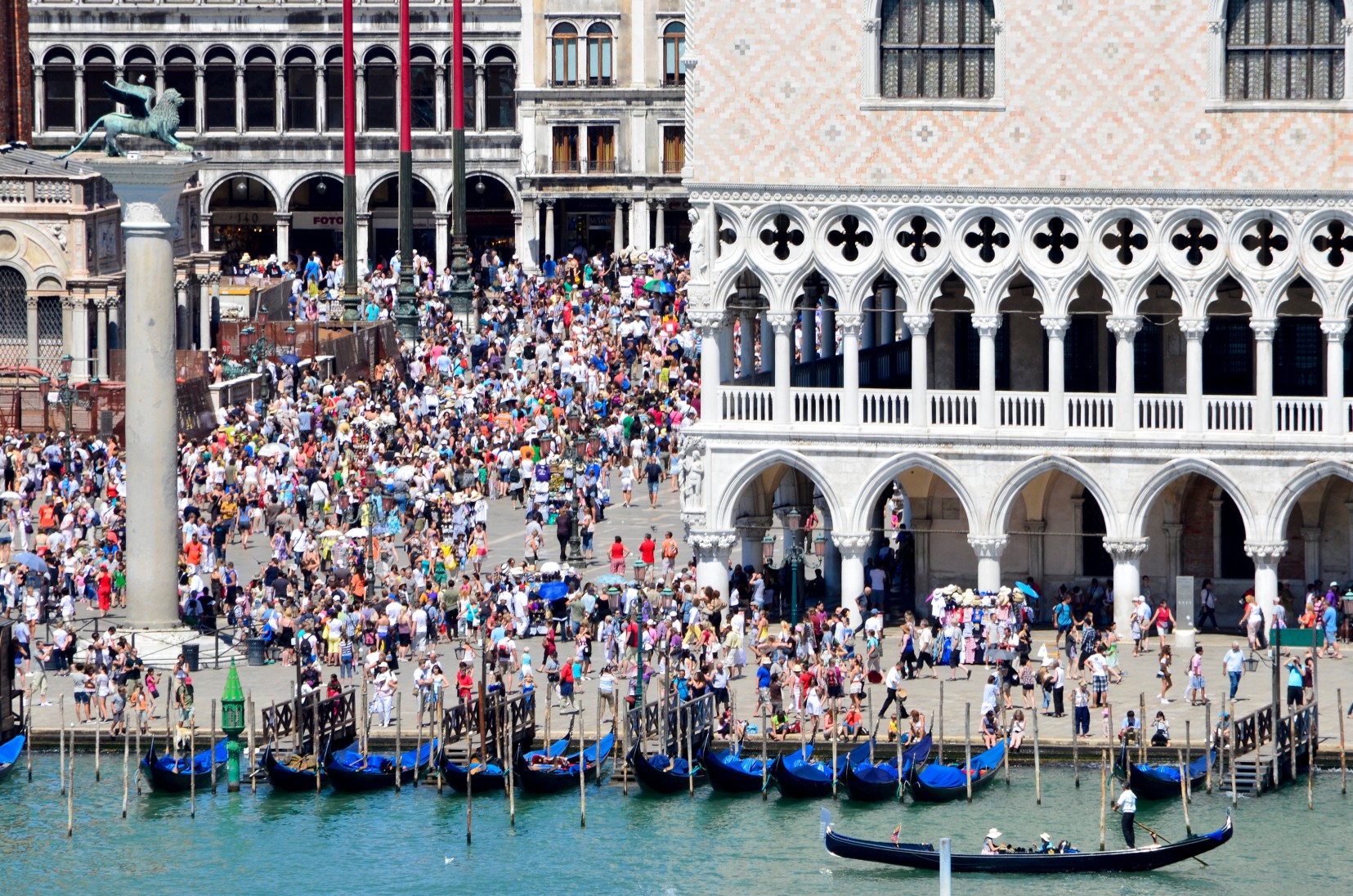 Summer tourists crown St Mark's Plaza in Venice, Italy