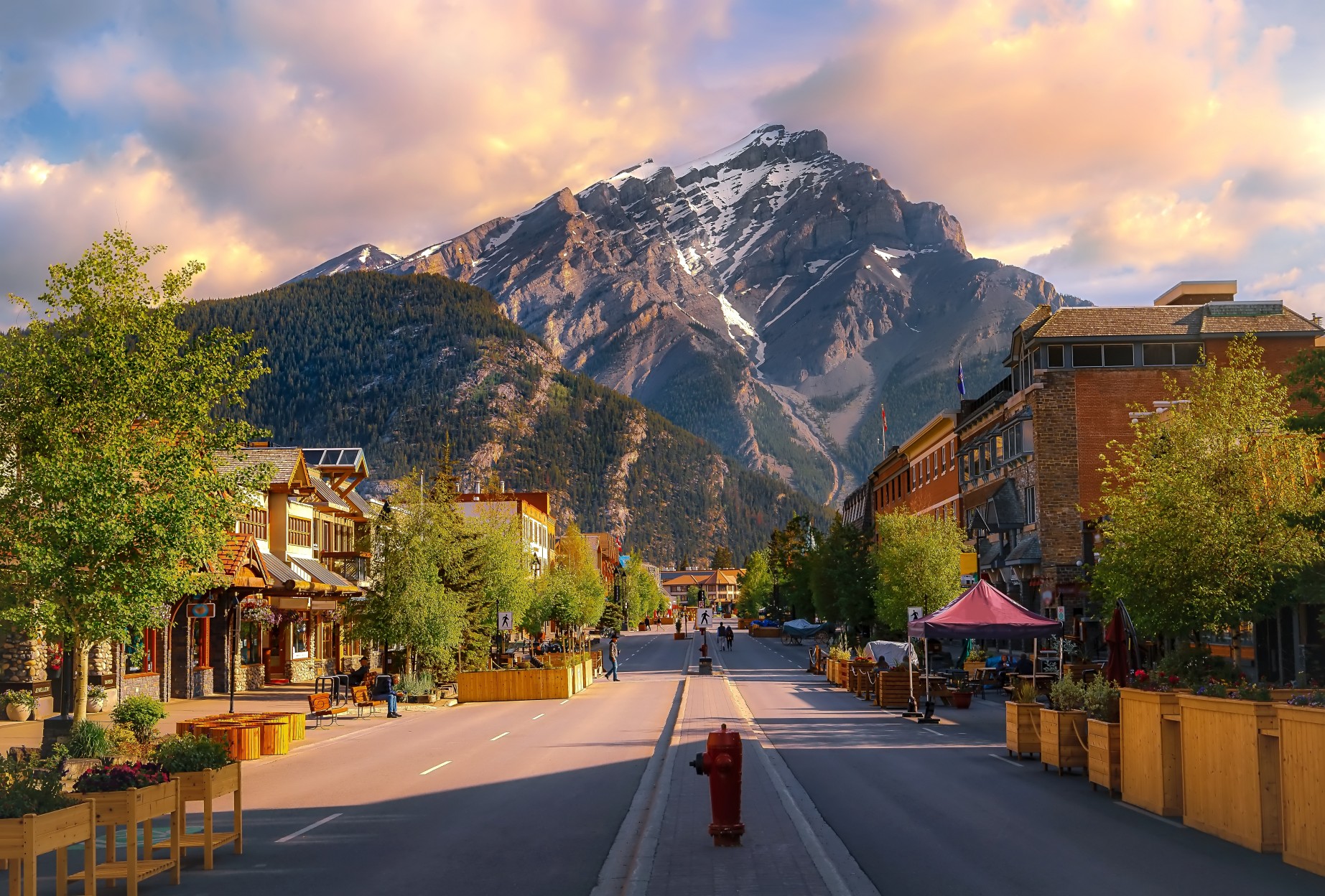 Sunrise Clouds Over A Mountain Road Through The Town Of Banff
