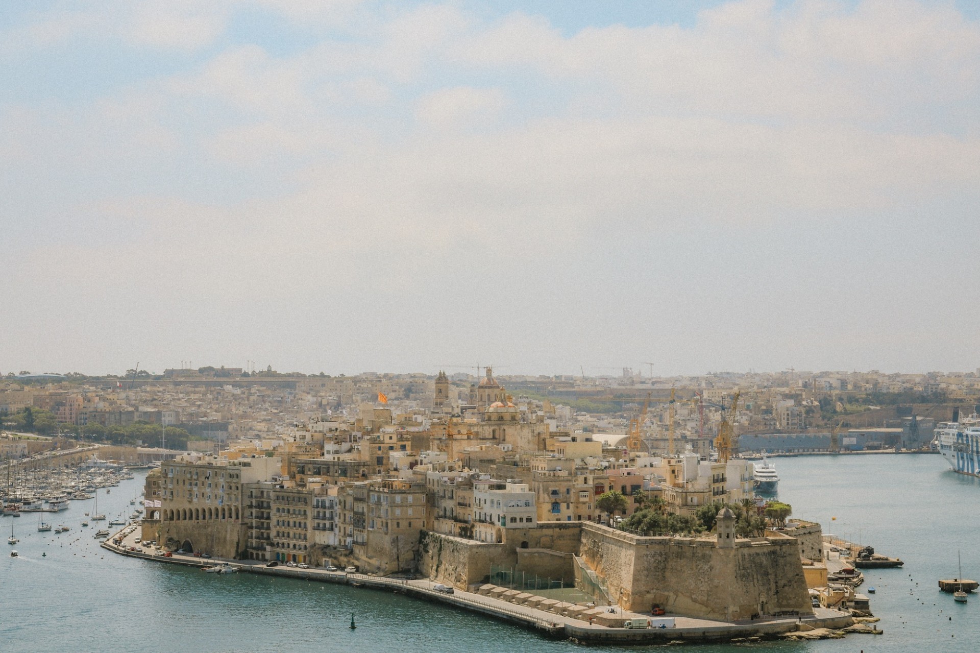 Historic waterfront and harbor in Valletta Malta with boats and Mediterranean architecture