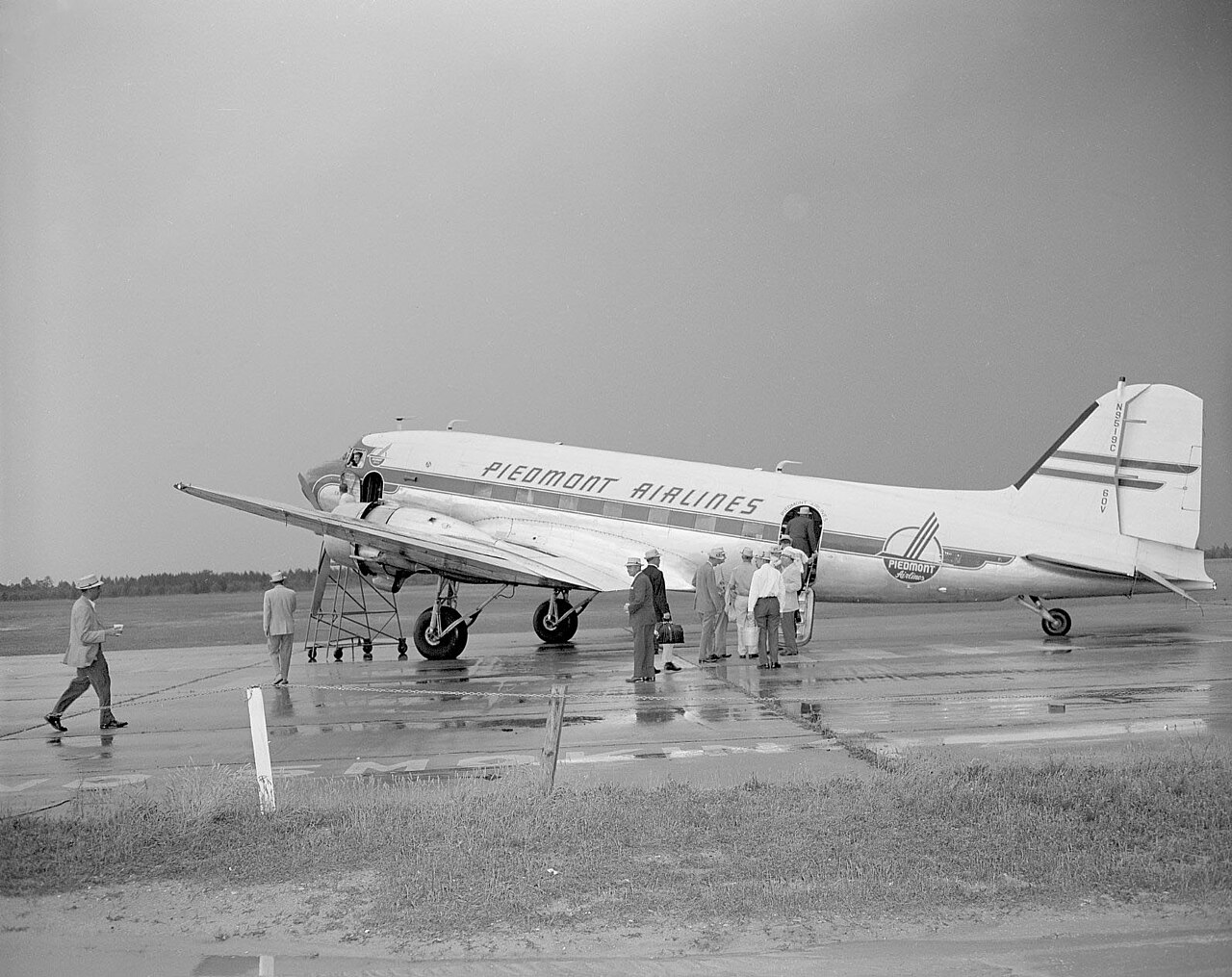 A Piedmont Airlines plane and seen at an airport, 1950s. From the Pryor Emerson Humphrey Photo Collection, PhC.180, State Archives of NC.