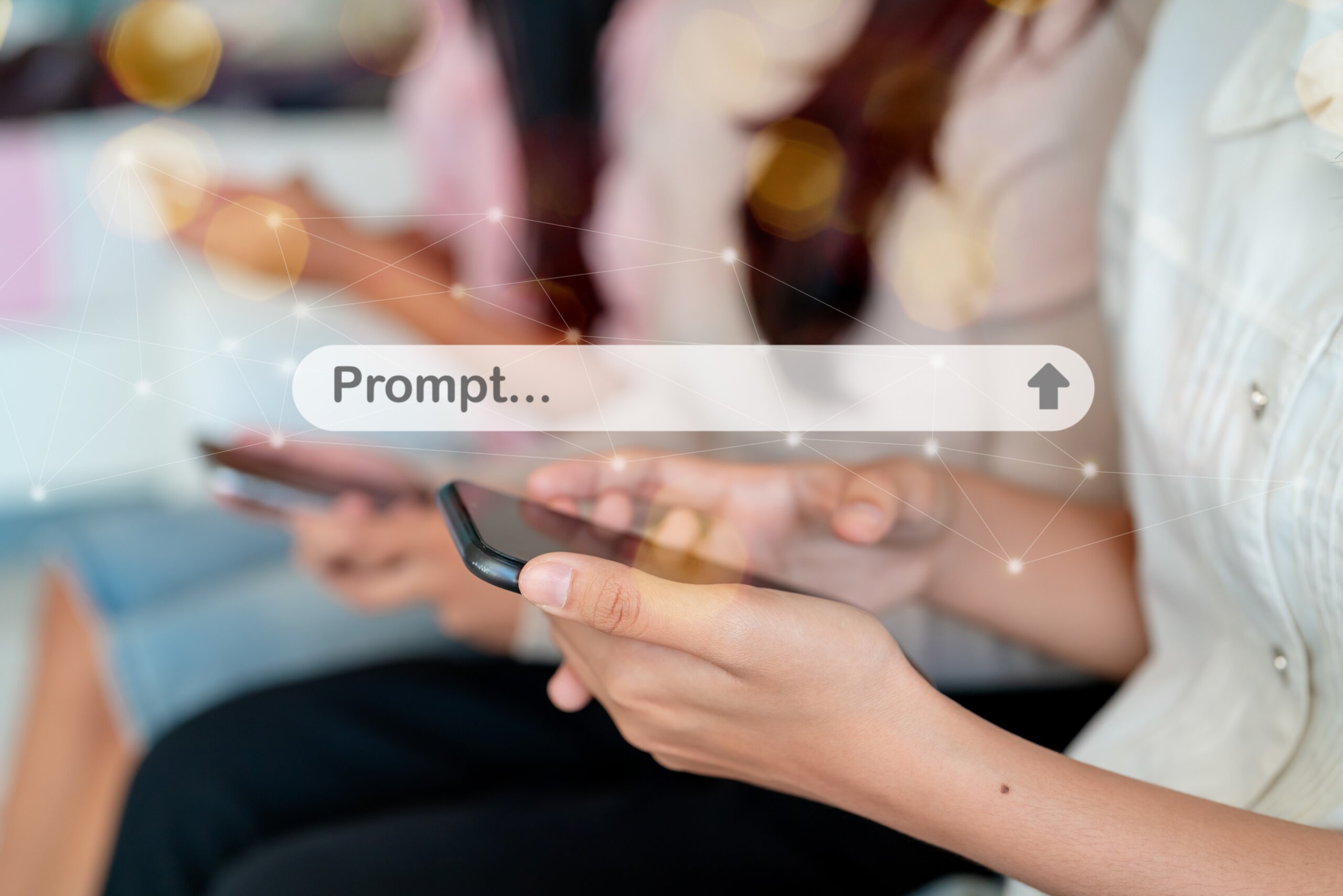 Close up of person using smartphone with AI prompt bar interface for generative artificial intelligence technology concept.
