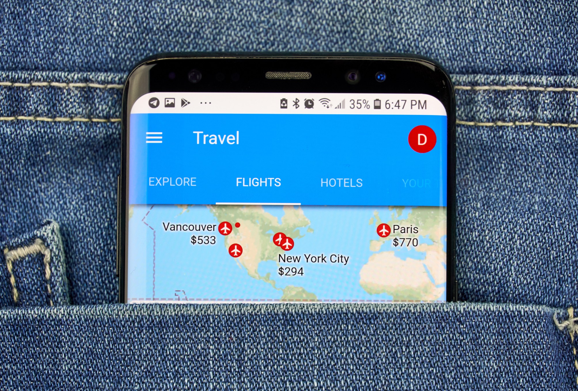 Smartphone displaying a travel booking app used to find cheaper flights with AI travel tools